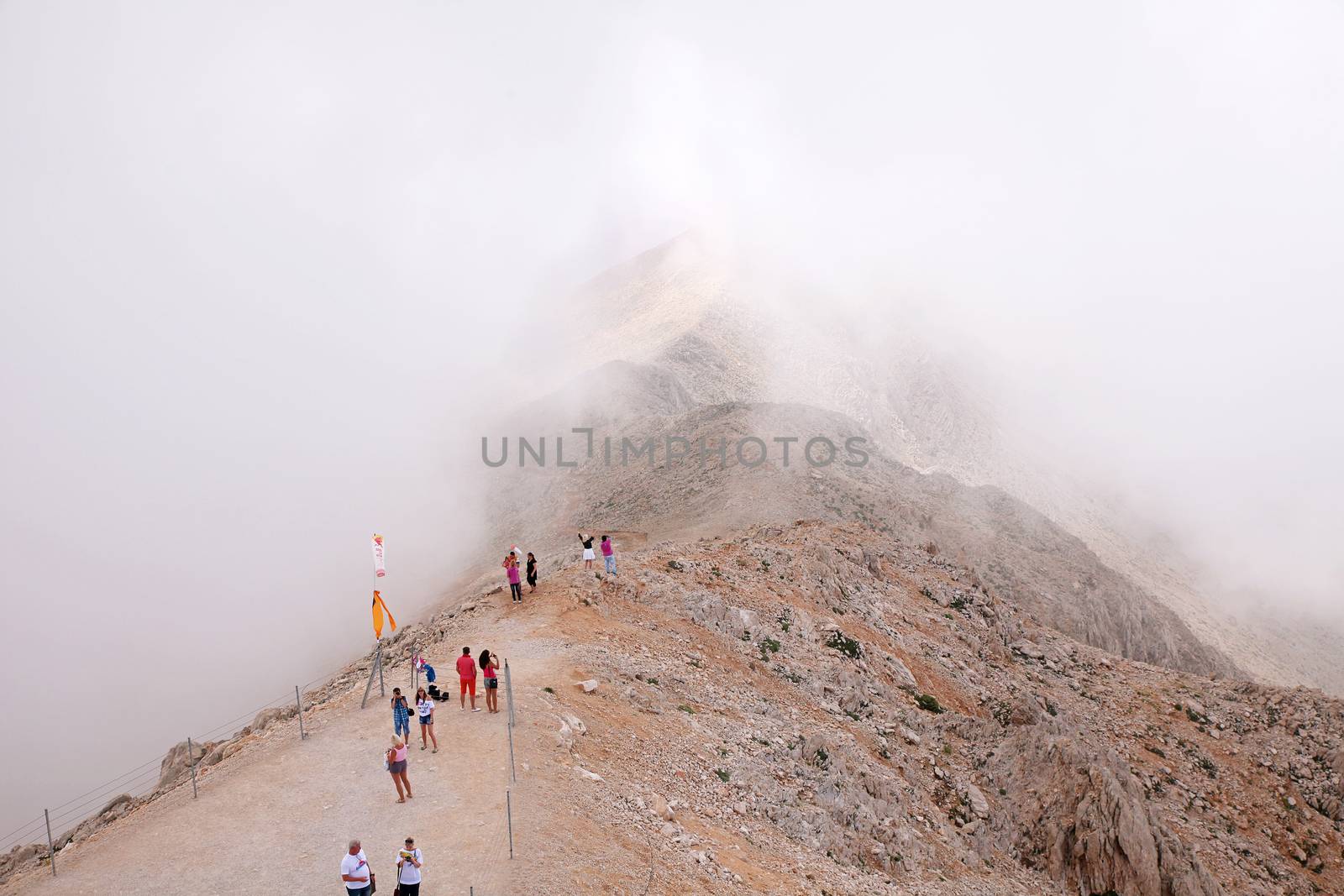 Tourists on top of the mountain Tahtali.Turkey. Kemer.17.07.2014