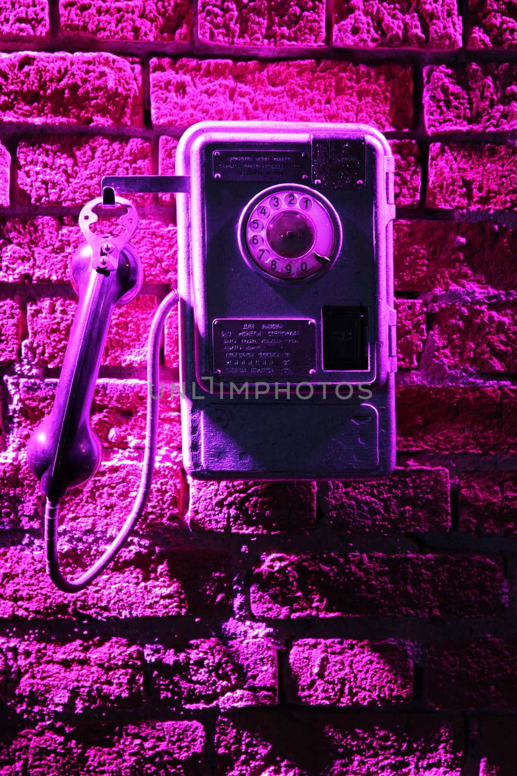 Phone on the brick wall by olga_zinovskaya
