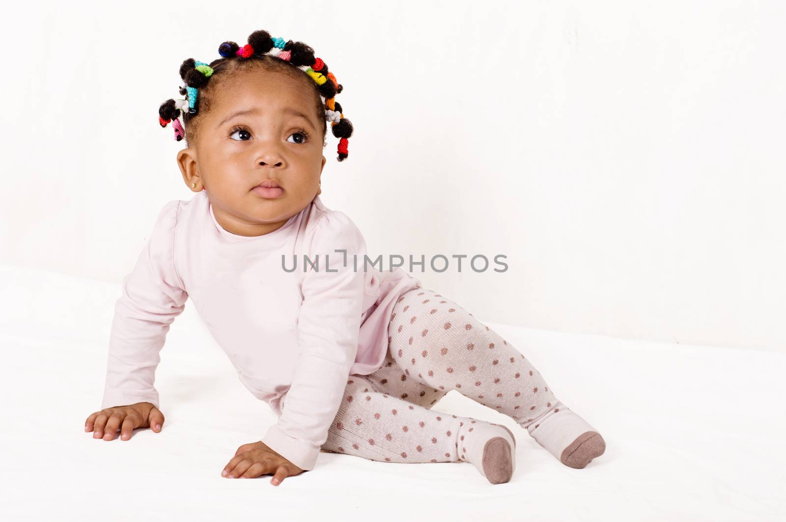 Portrait of a nice baby looking up isolated on a white background.