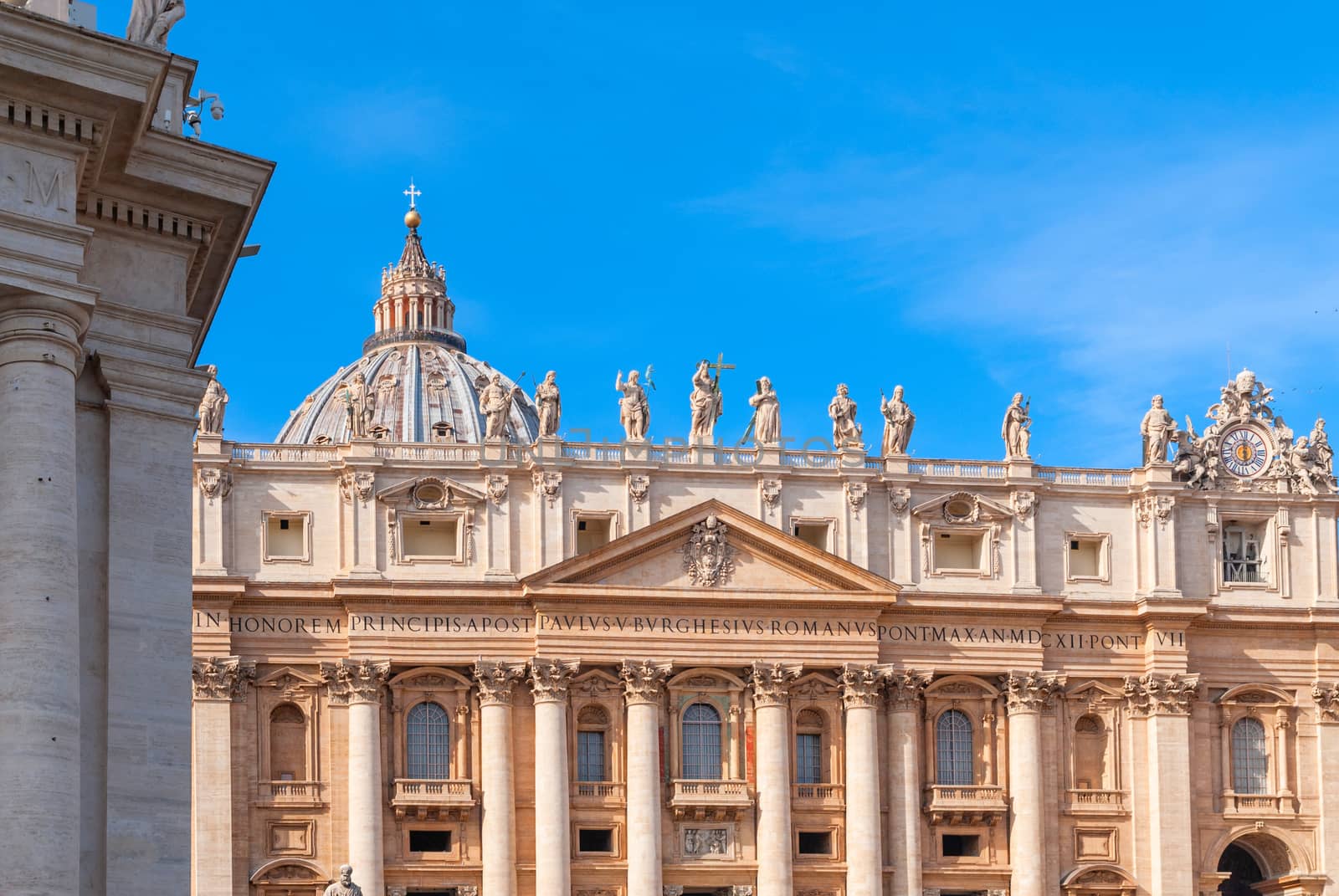 St Peter's Basilica on blue sky background. Vatican, Italy