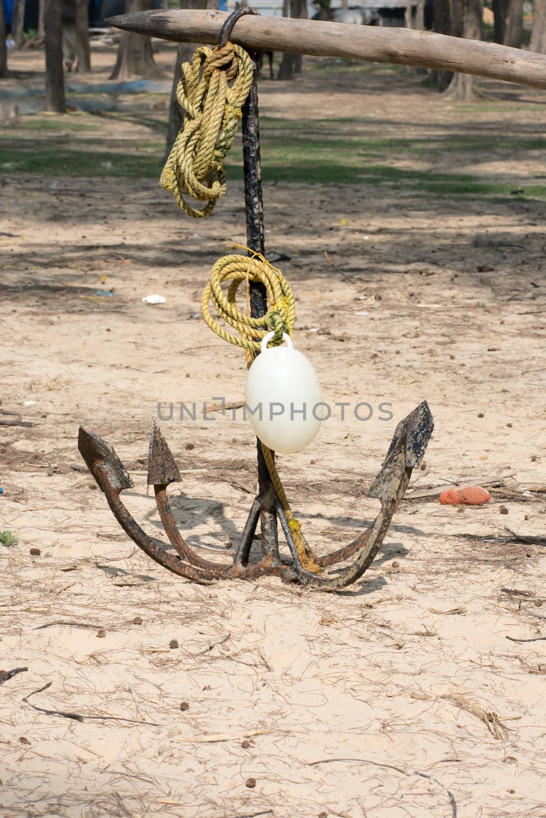 A Boat anchor ( Nongor) in a summer sea beach. Iron metal make device Equipment. Technology to connect a nautical vessel with riverbank from drifting due to wind. Water Transportation background.