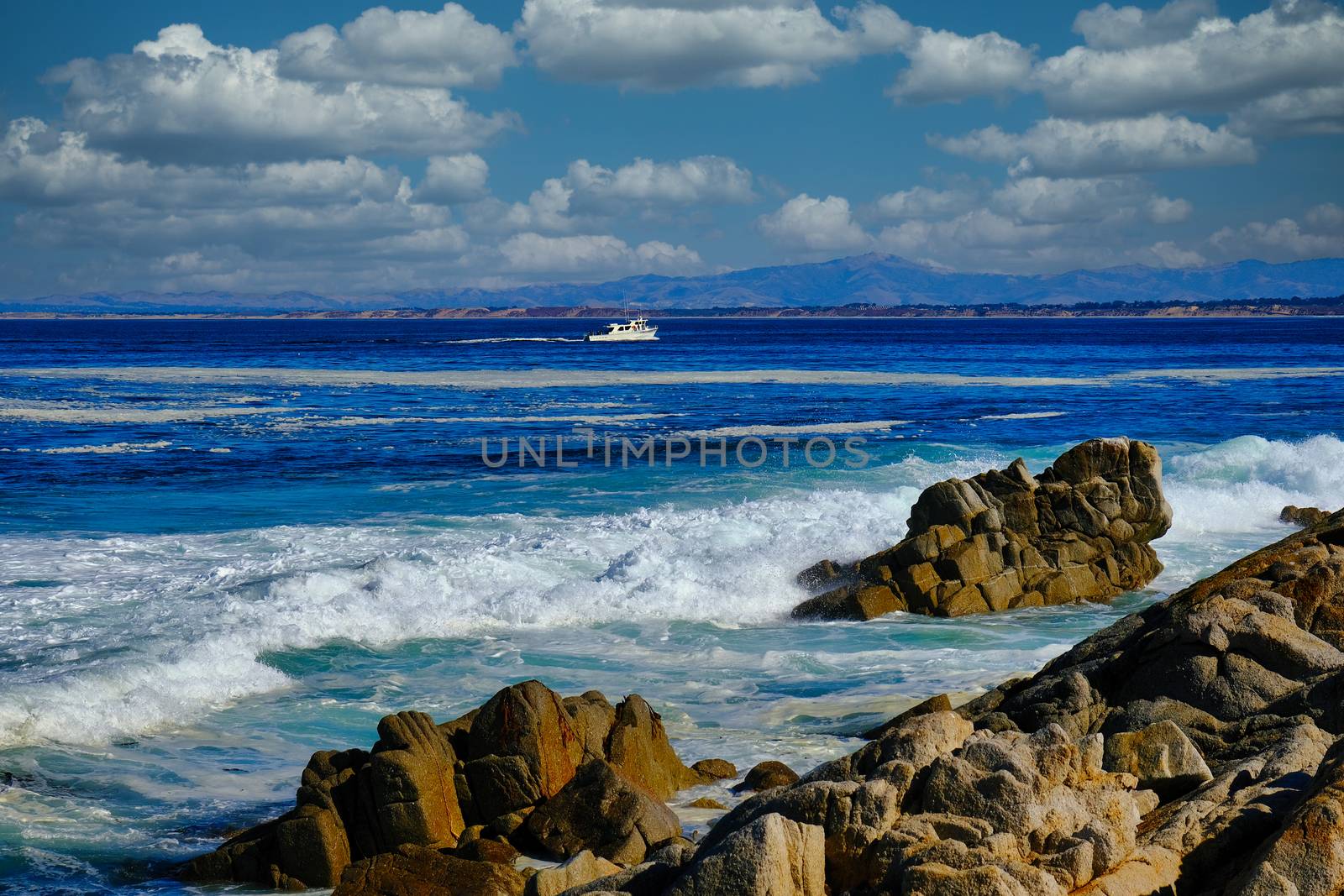 White Fishing Boat Crossing Channel in Monterey