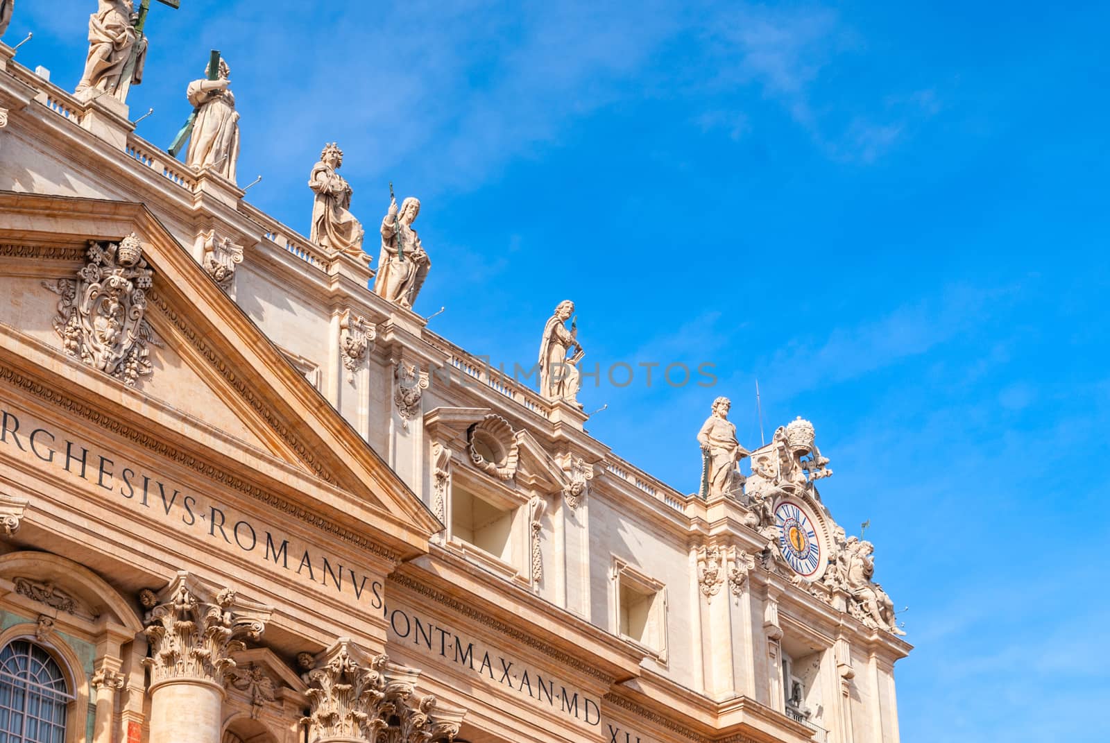 St Peter's Basilica on blue sky background. Vatican, Italy