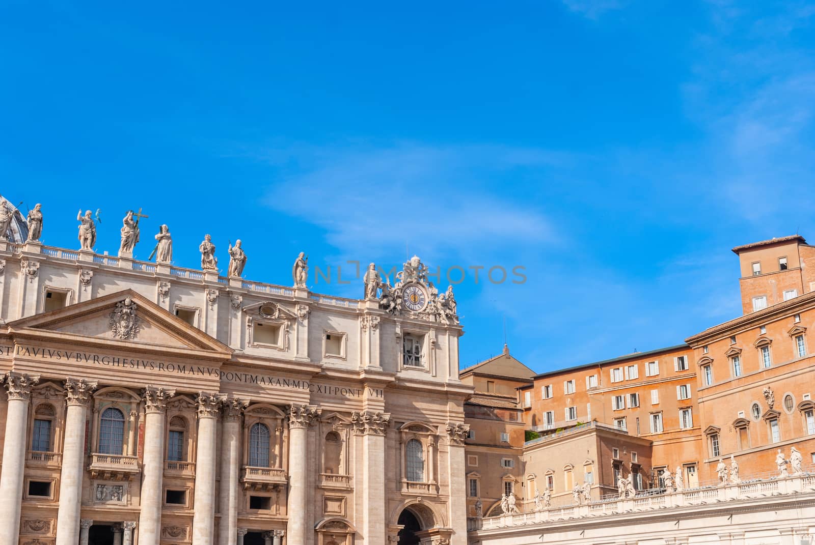 St Peter's Basilica on blue sky background. Vatican, Italy