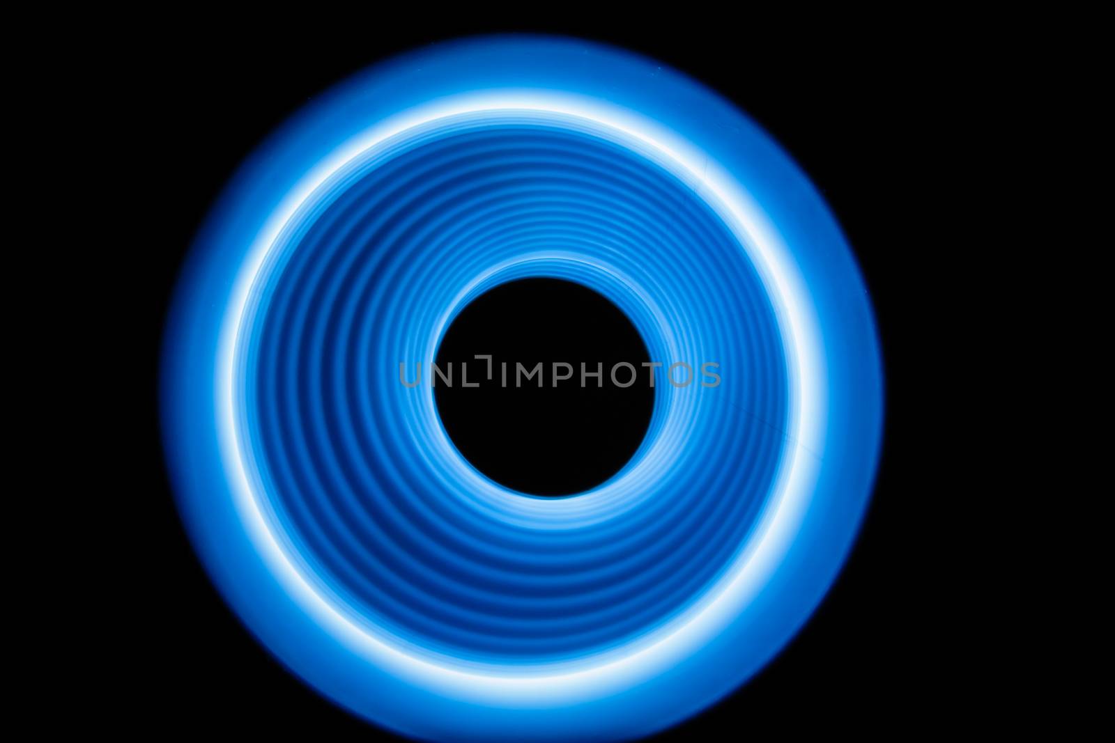 Blurred sound waves in the visible blue color in the dark