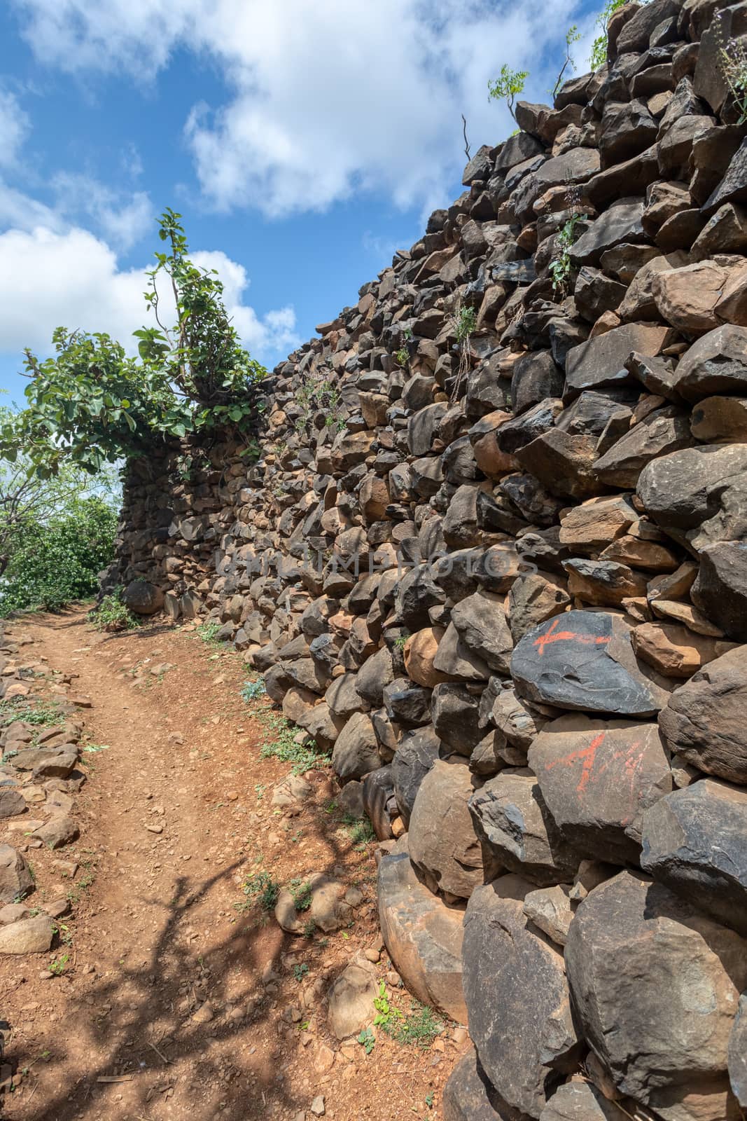 Narrow pathway in Konso, walled village tribes Konso. Africa, Ethiopia. Konso villages are listed as UNESCO World Heritage sites.