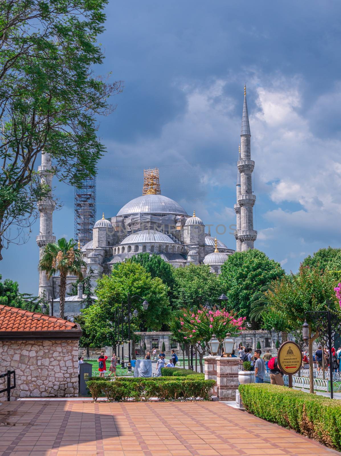 Istambul, Turkey – 07.12.2019. Many tourists walk around Sultan Ahmet Park on the site of a former Hippodrome in Istanbul, Turkey, on a cloudy summer day