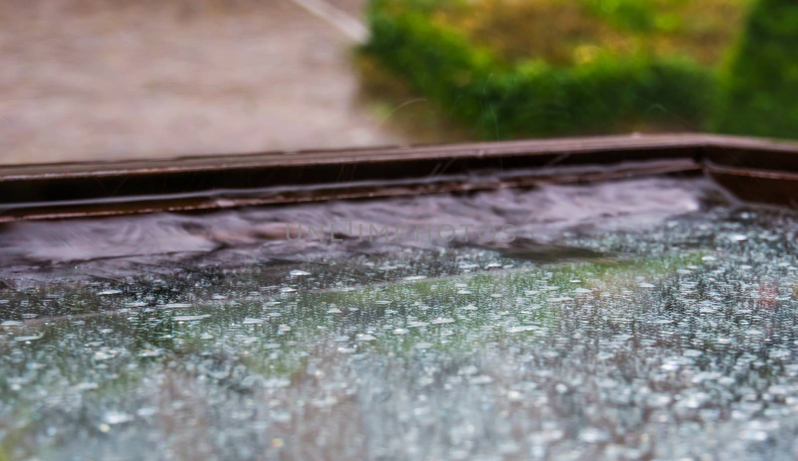 closeup of a wet window during rainy weather, the european climate