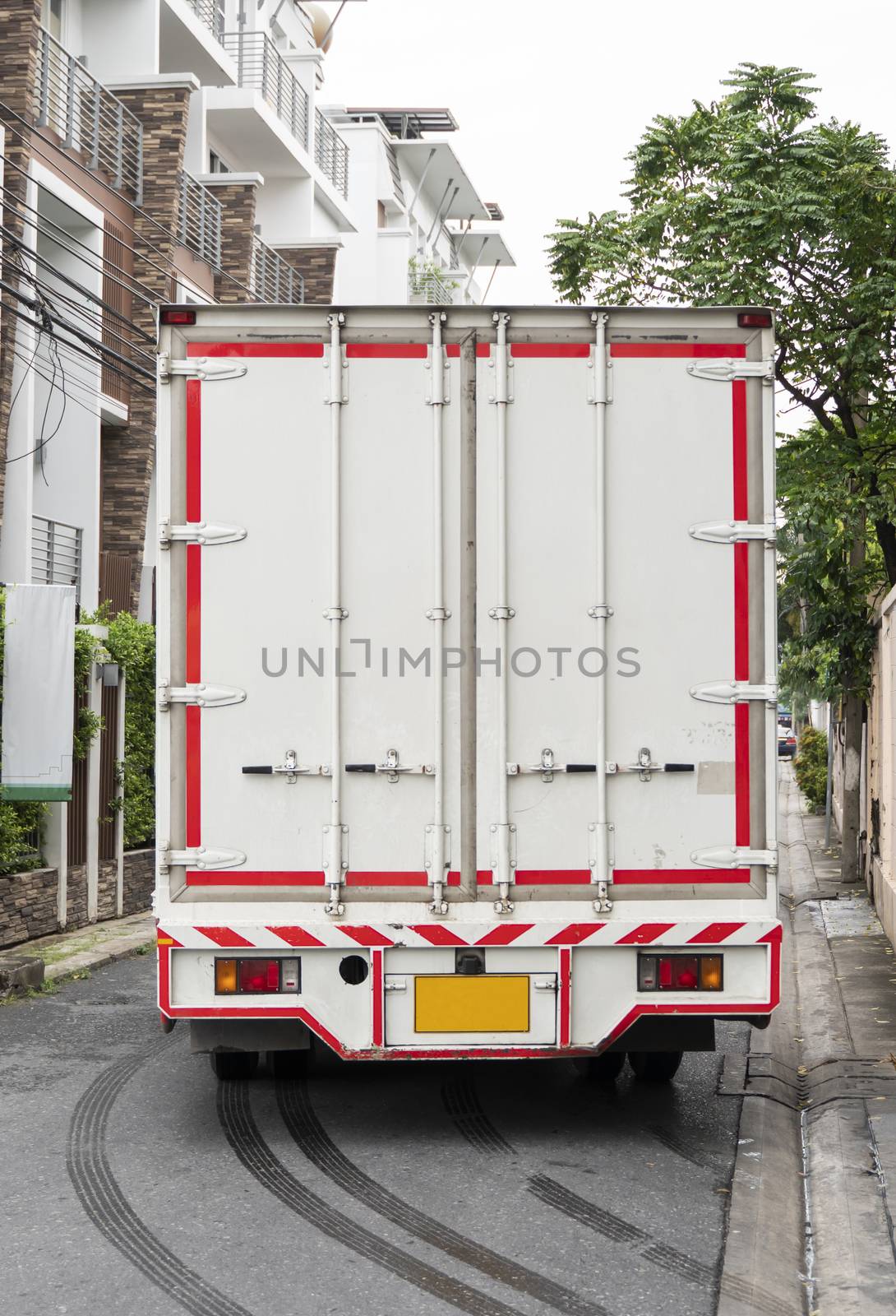 Details of White truck for delivery of goods and products. Transportation and Logistics