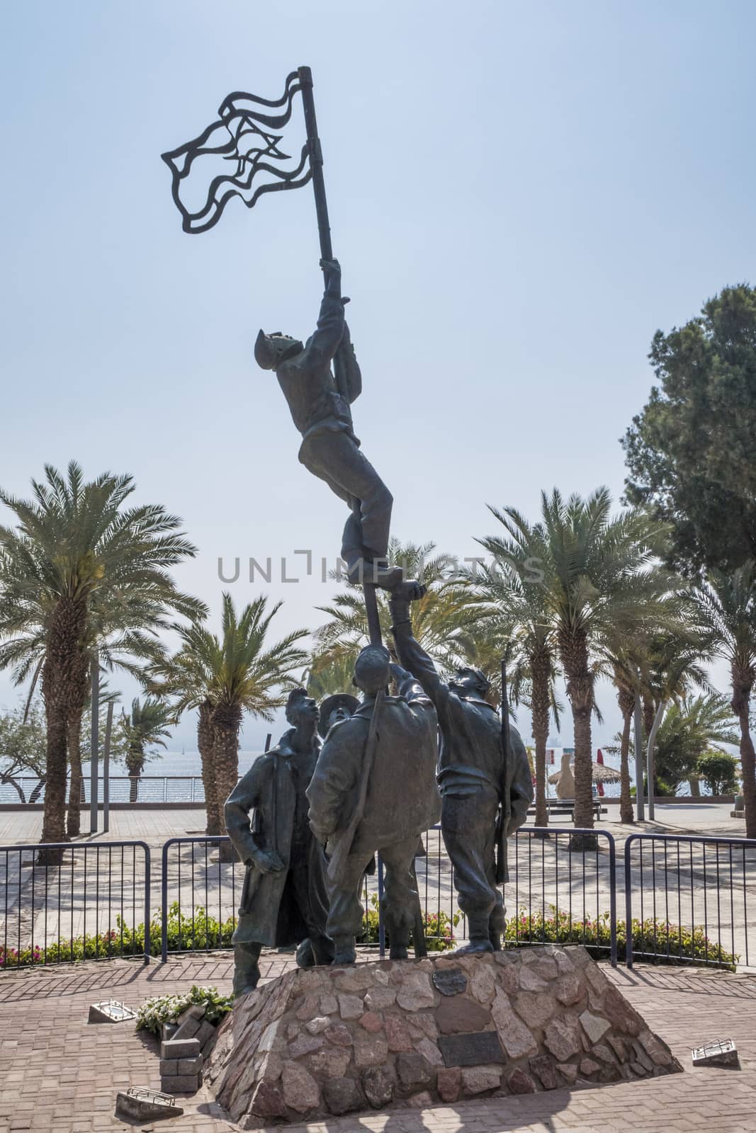 Eilat,21-march-2019:Israel Eilat sculpture Um Rash Rash by M Kapri view with palm trees sea and mountains in bkgd