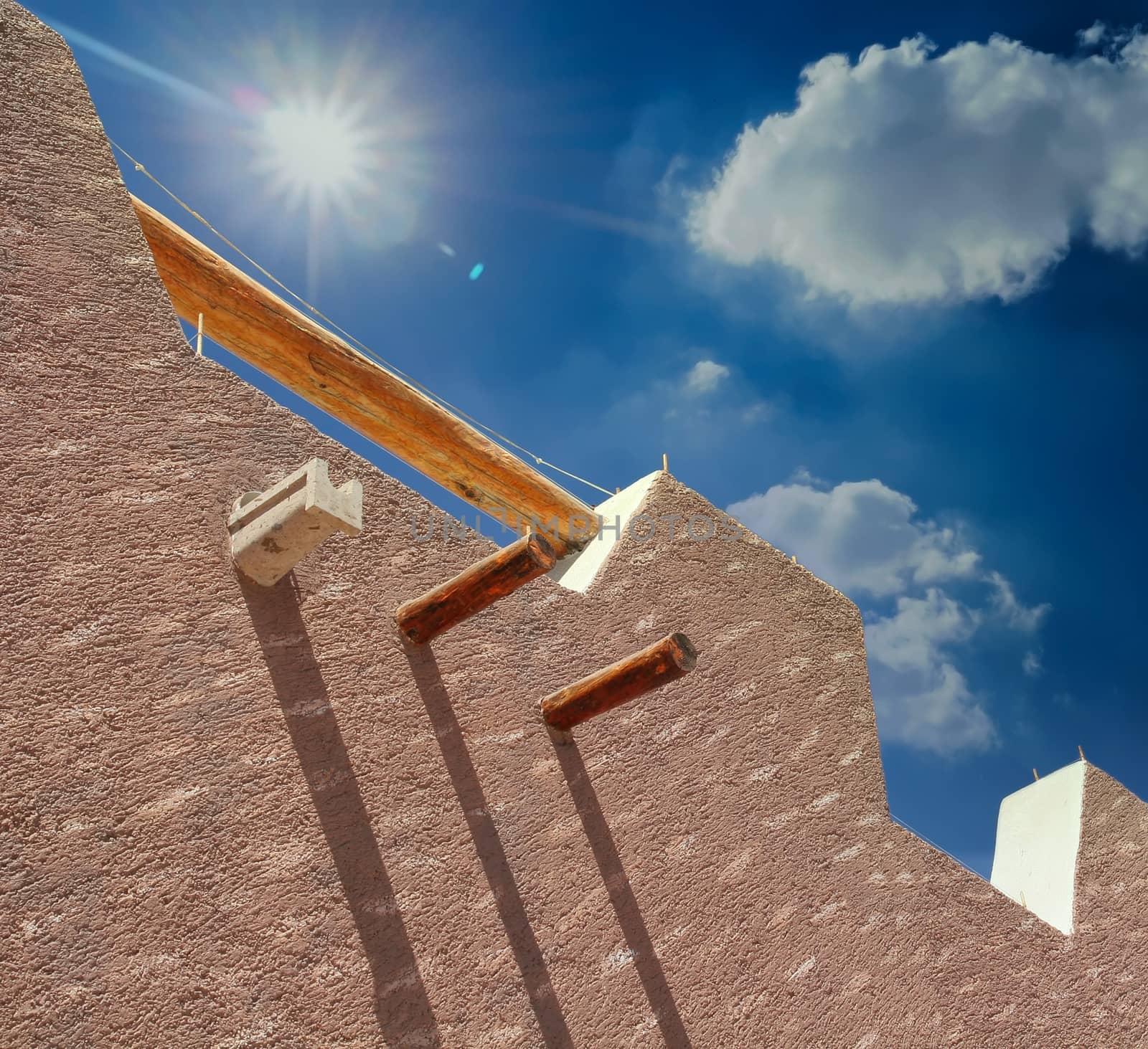 A nice textured stucco wall against a blue sky