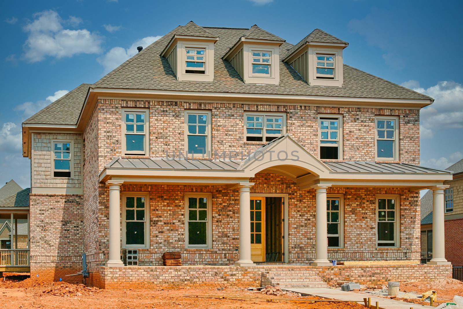 A new house under construction with wood and brick