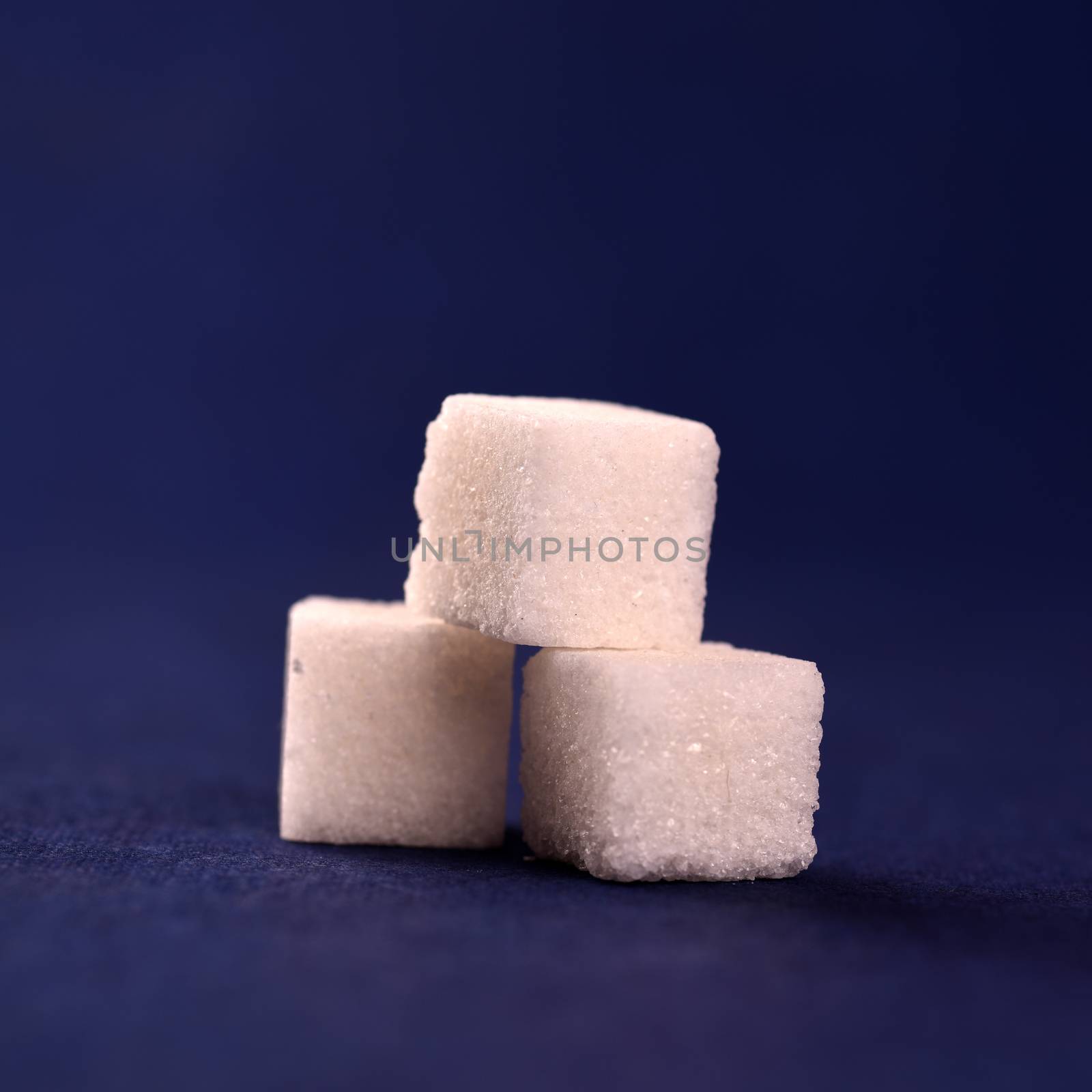 Close-up of Sugar Cubes on Blue Background