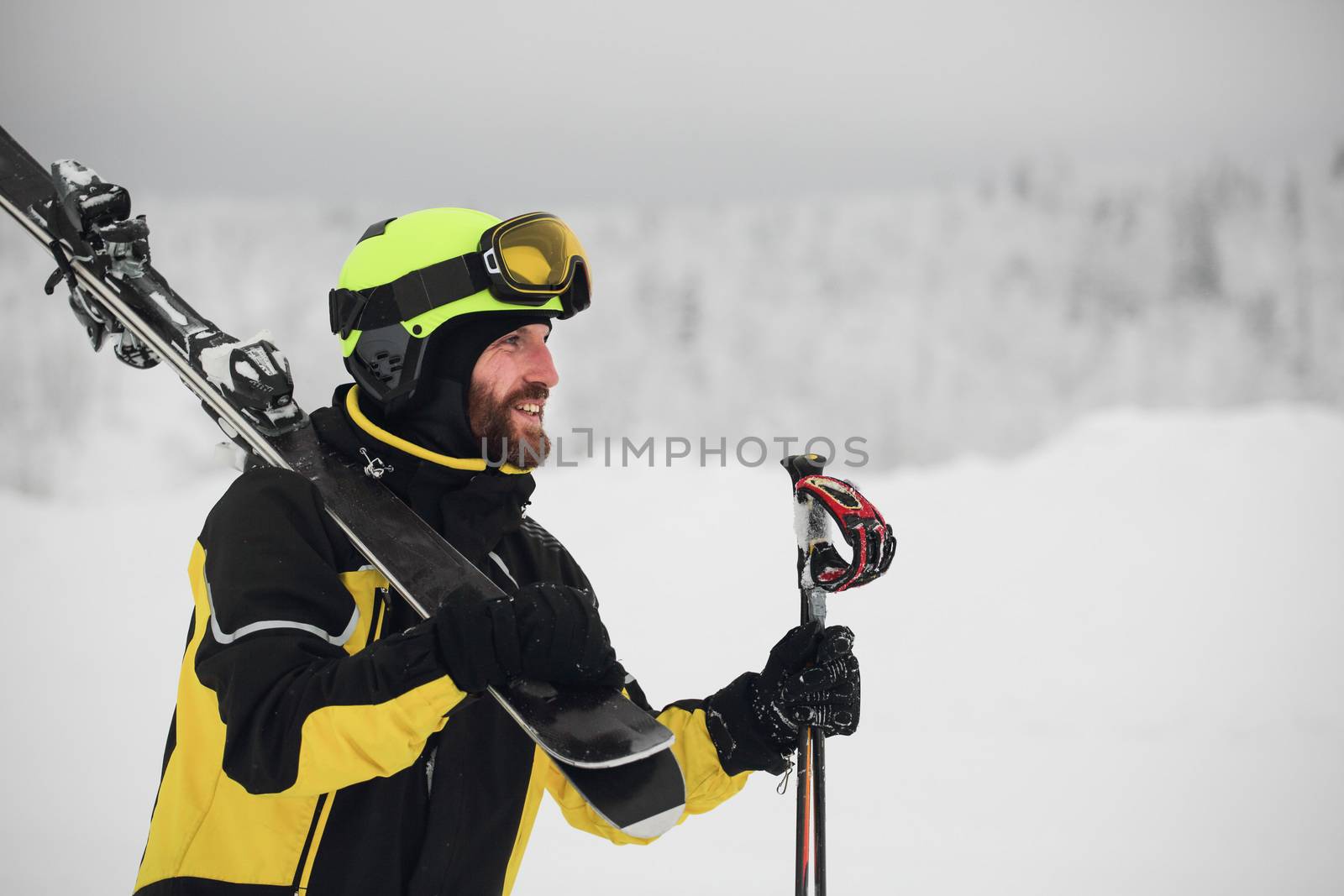 Portrait of a happy male skier by destillat