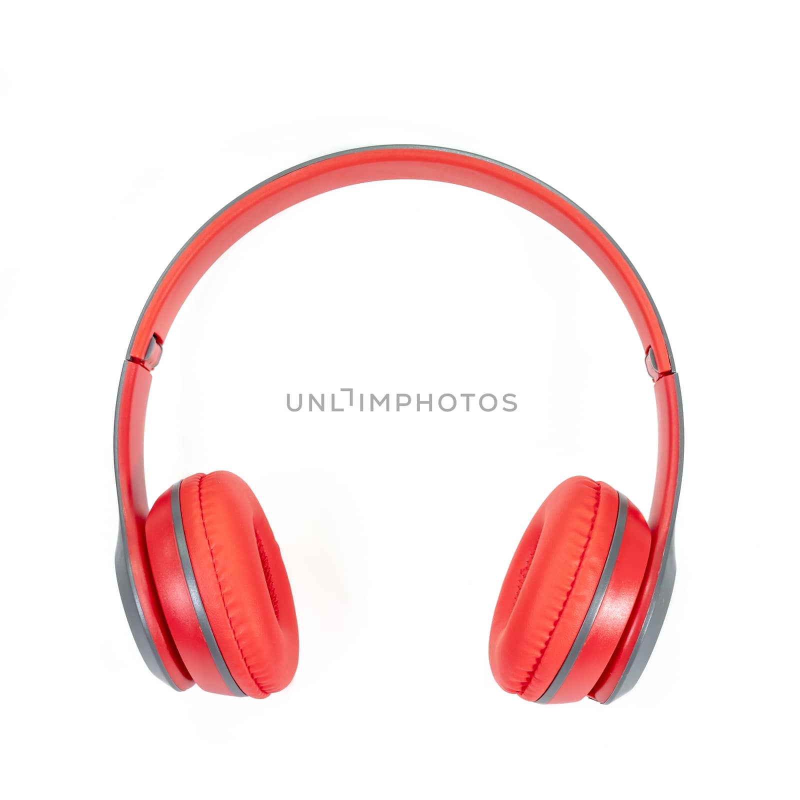 The close up of Modern red wireless headphone isolated on white background.