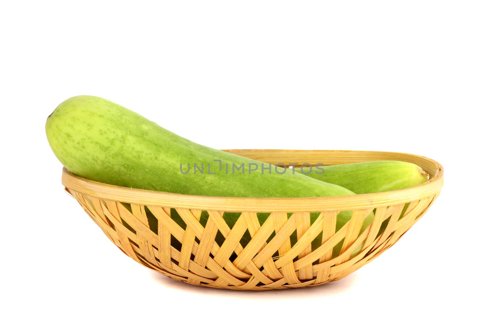 Fresh Cucumbers in basket isolated on white background