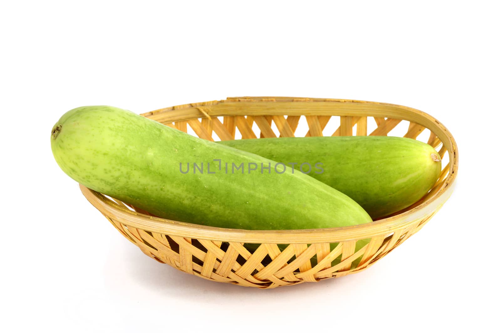 Fresh Cucumbers in basket isolated on white background