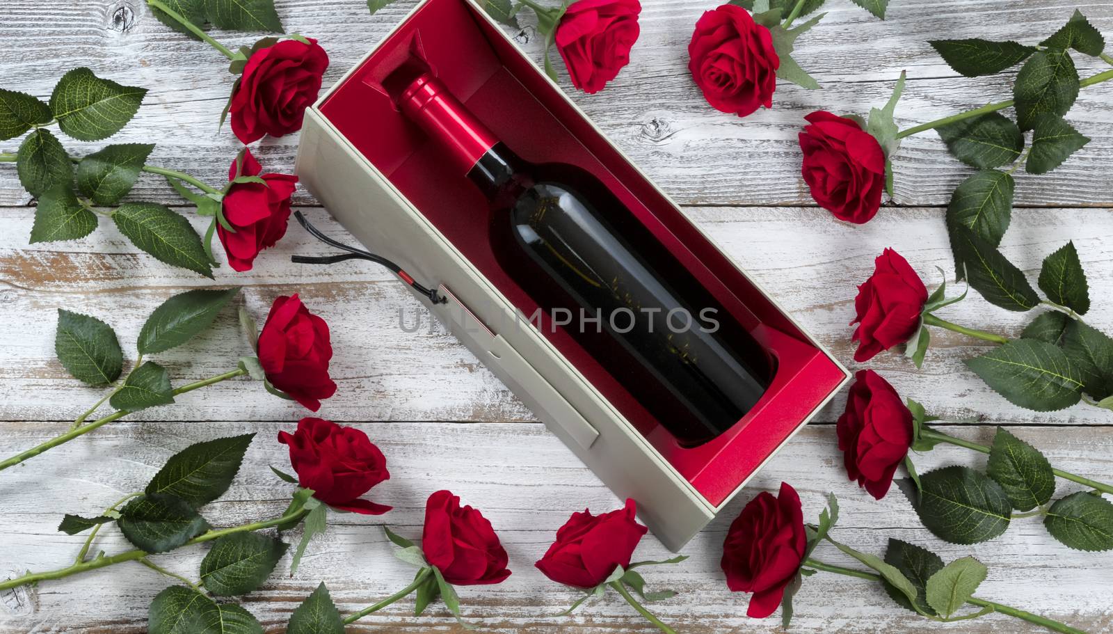 Happy Valentines Day celebration with red roses and wine on whit by tab1962