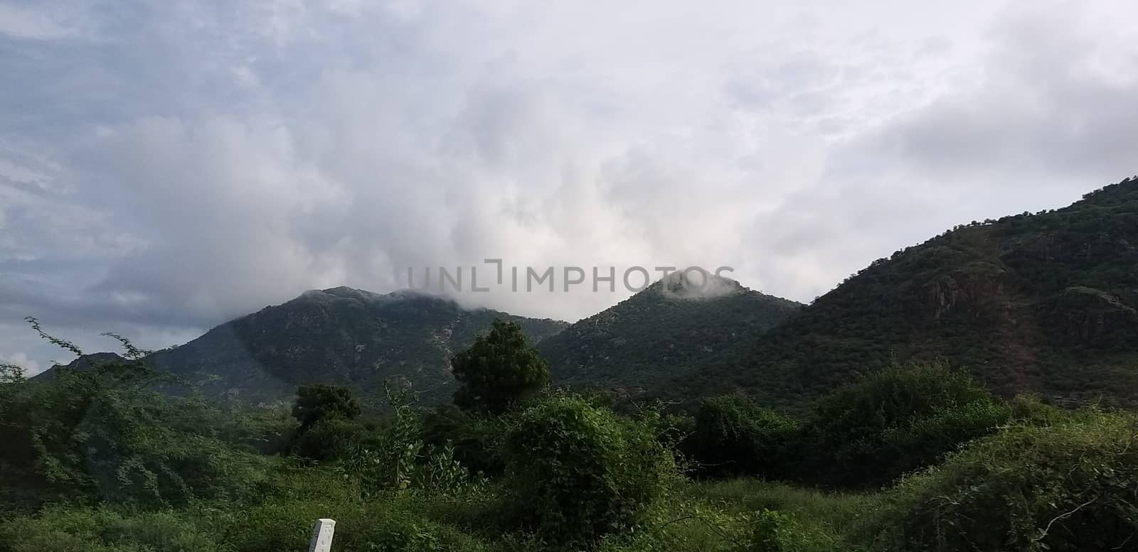 a mountain range during rainy season by gswagh71