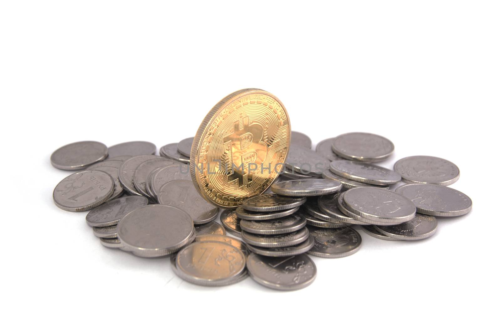 Bitcoin golden on top of other coins isolated on white background clipping path