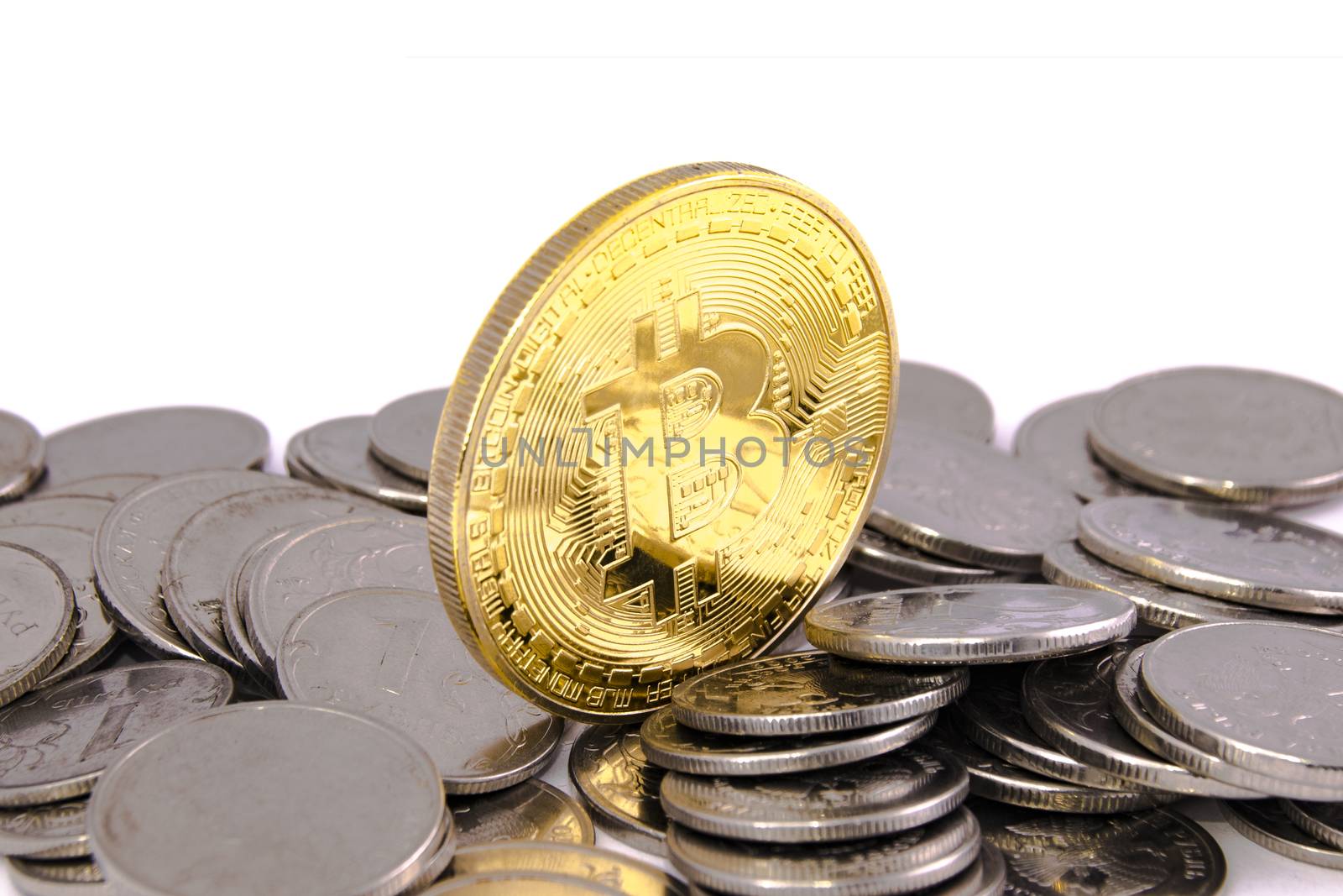 Bitcoin golden on top of other coins closeup