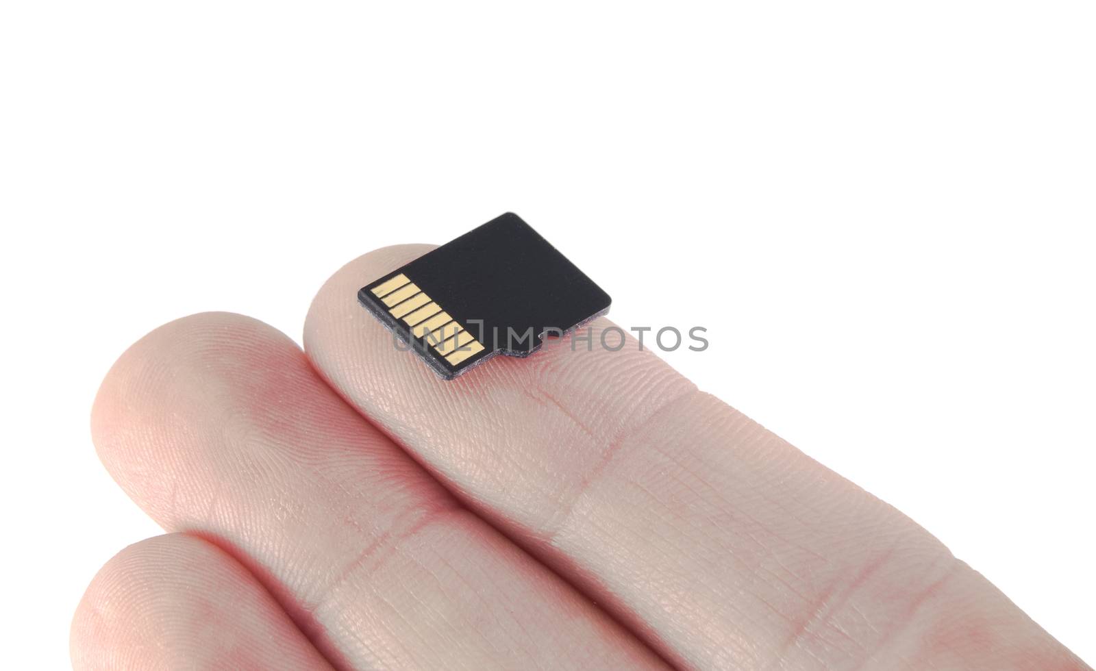 memory card on finger micro SD flash on white background