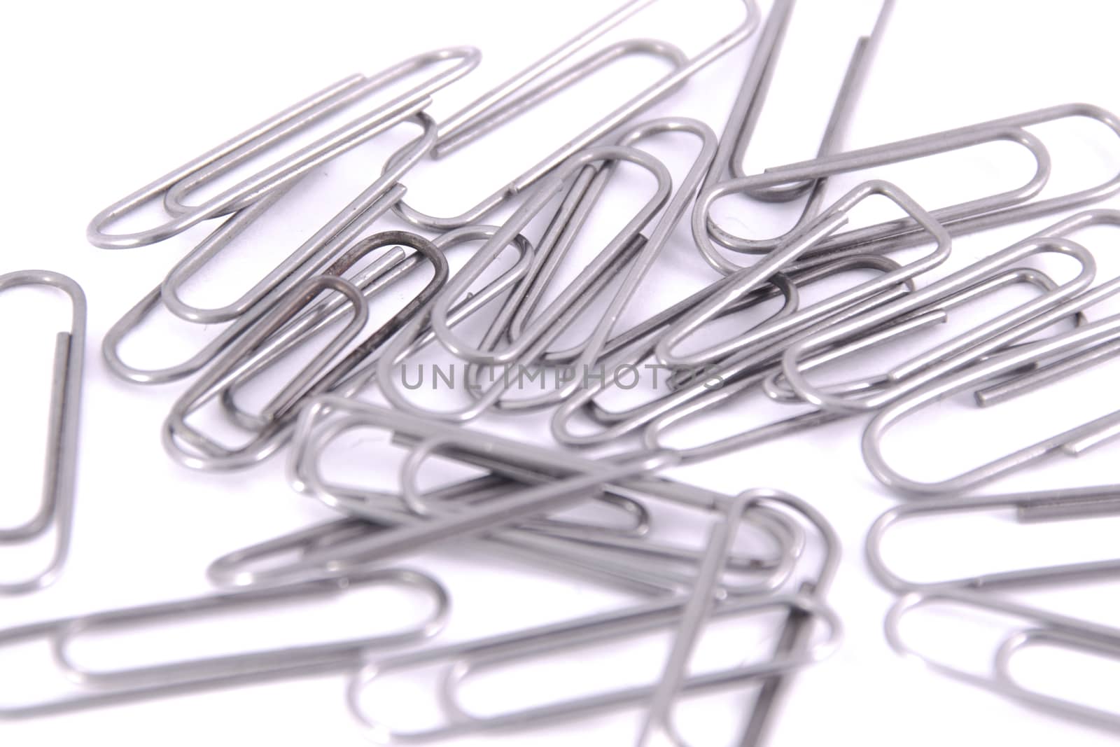 many paper clips metal clip on the white background