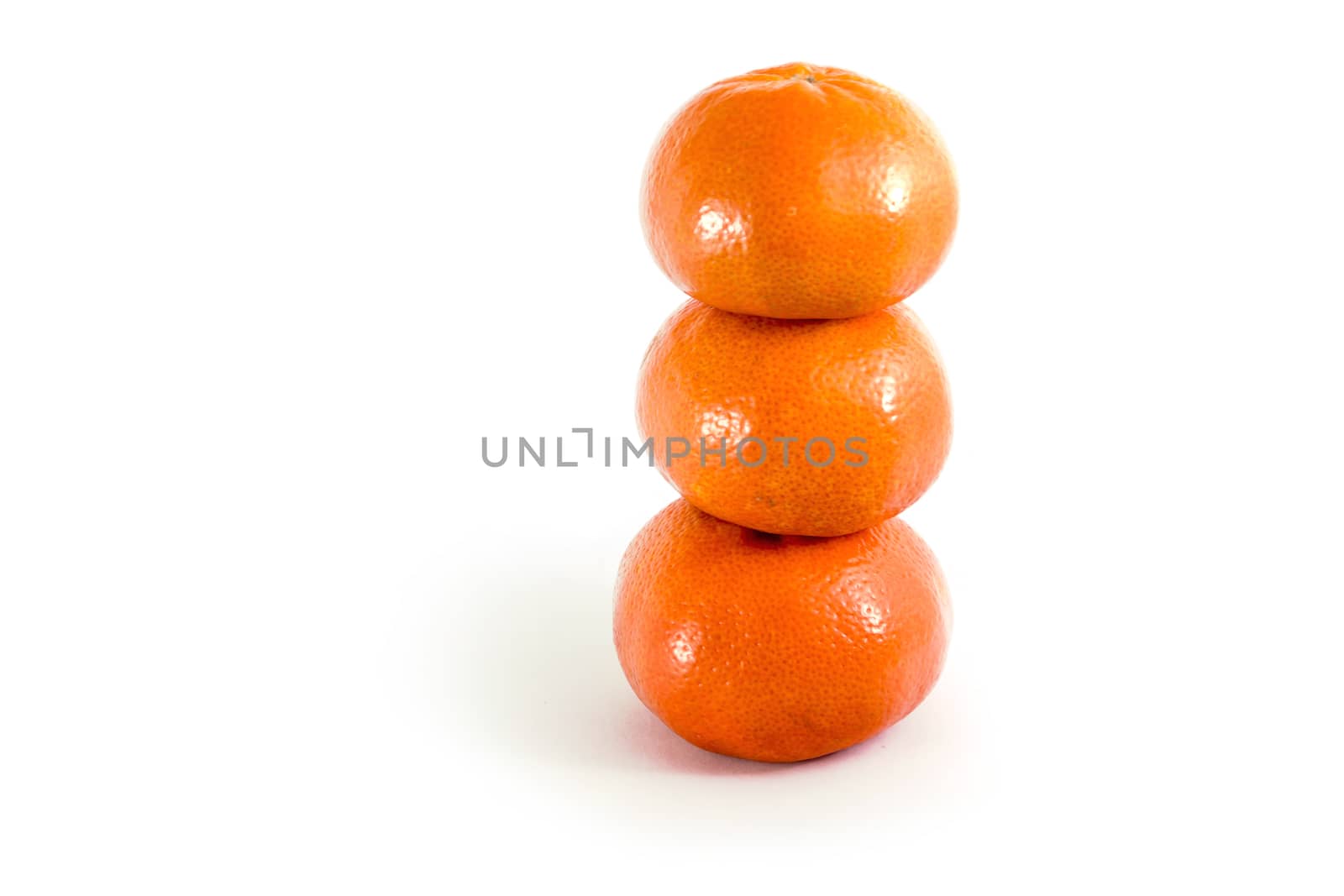 three orange Mandarin tangerine isolated