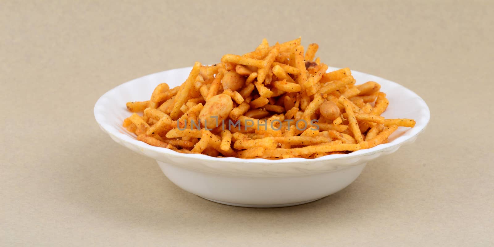 Deep fried salty dish - chivda or mixture made of gram flour and mixed with dry fruits.