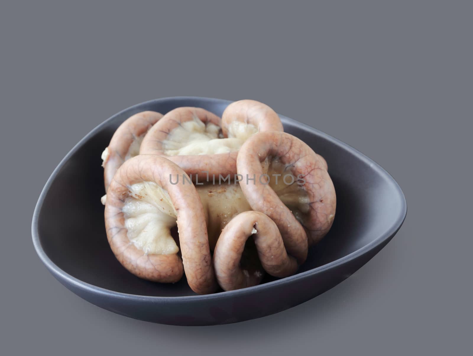 Boiled chitterlings internal organs of pig isolated on gray background, clipping path.