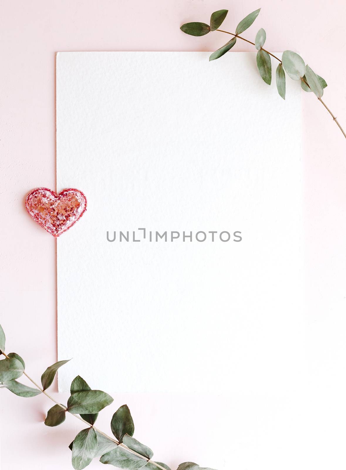 Background with copy space blank on pink background with pink glittered hearts, eucalyptus branch. White paper top view, flat lay, minimal style. Moke up card. by Denys_N