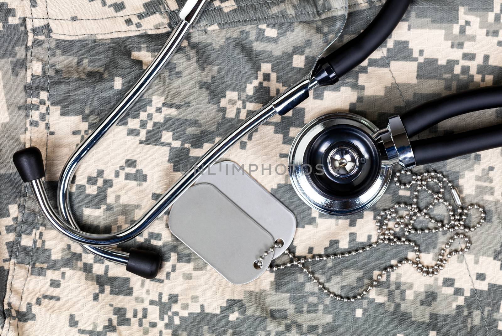 Military medical concept with stethoscope and identification tag by tab1962