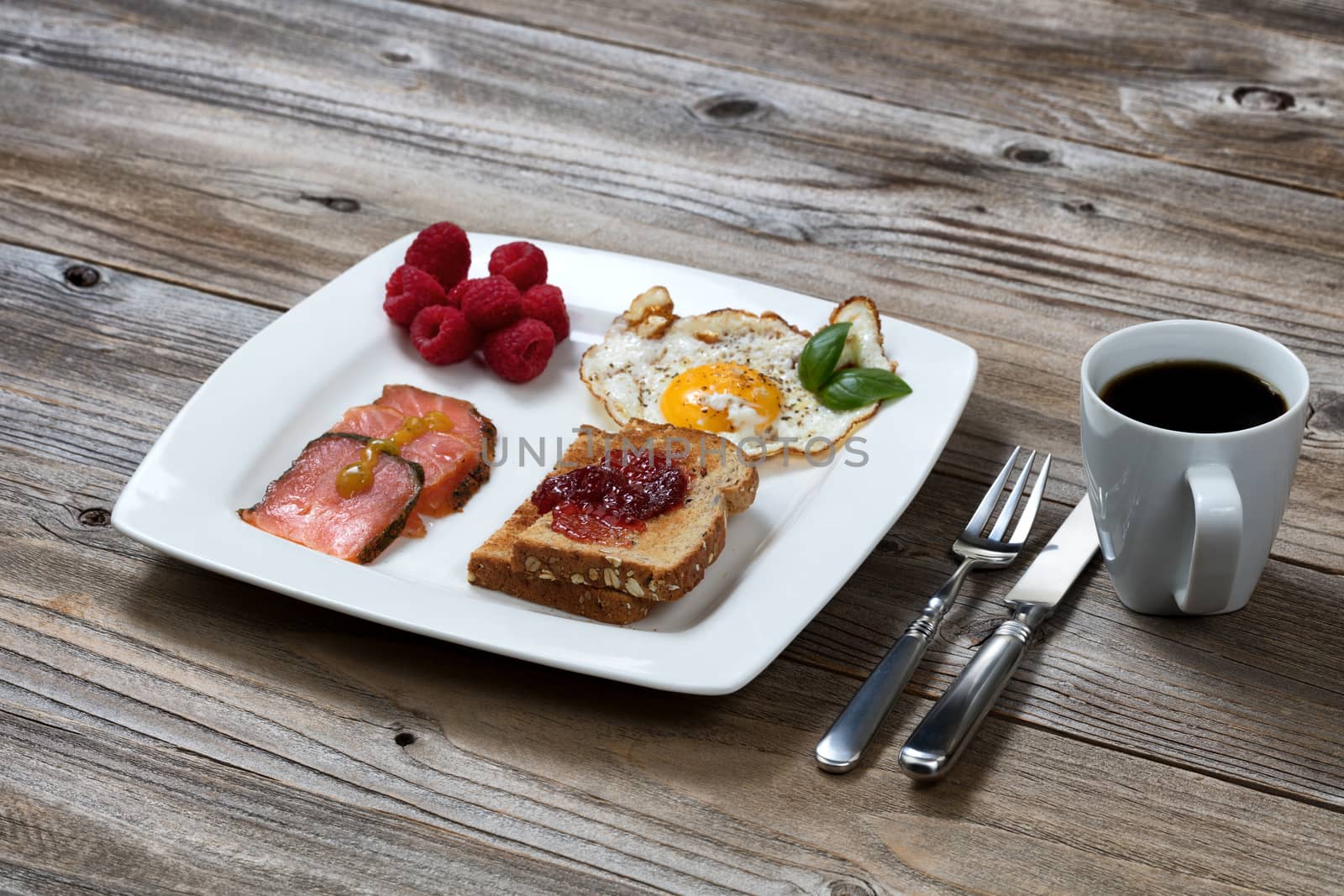 Freshly cooked morning meal on rustic wooden table  by tab1962
