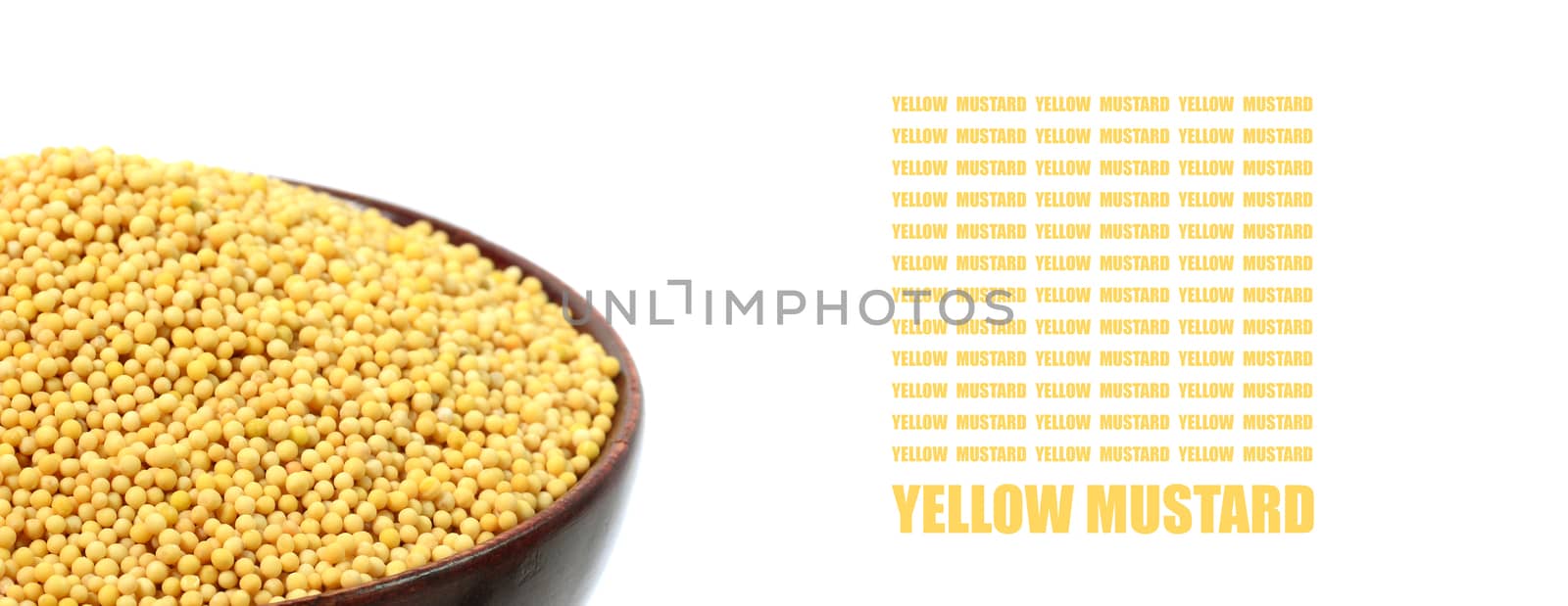 yellow mustard seeds in wooden bowl isolated on white background