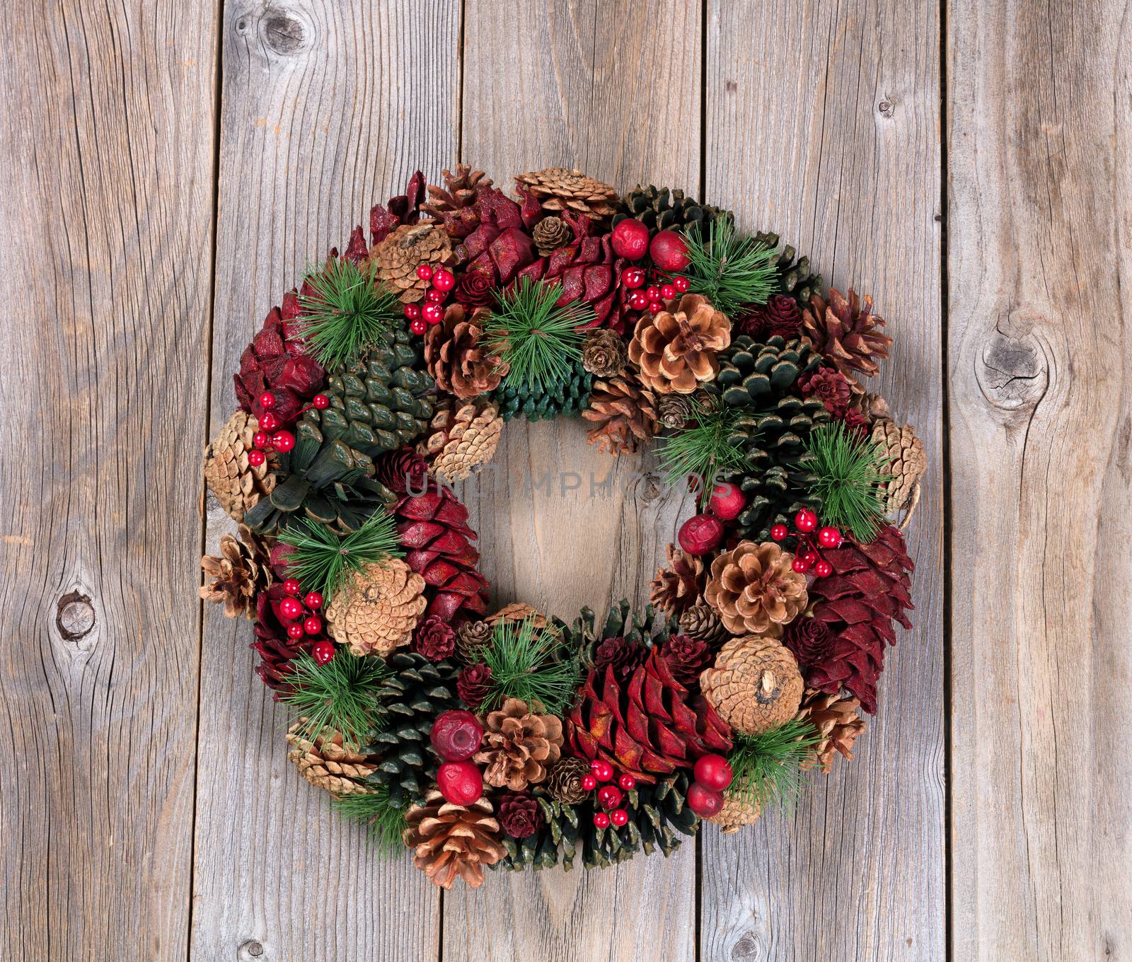 Holiday wreath on rustic wooden boards by tab1962