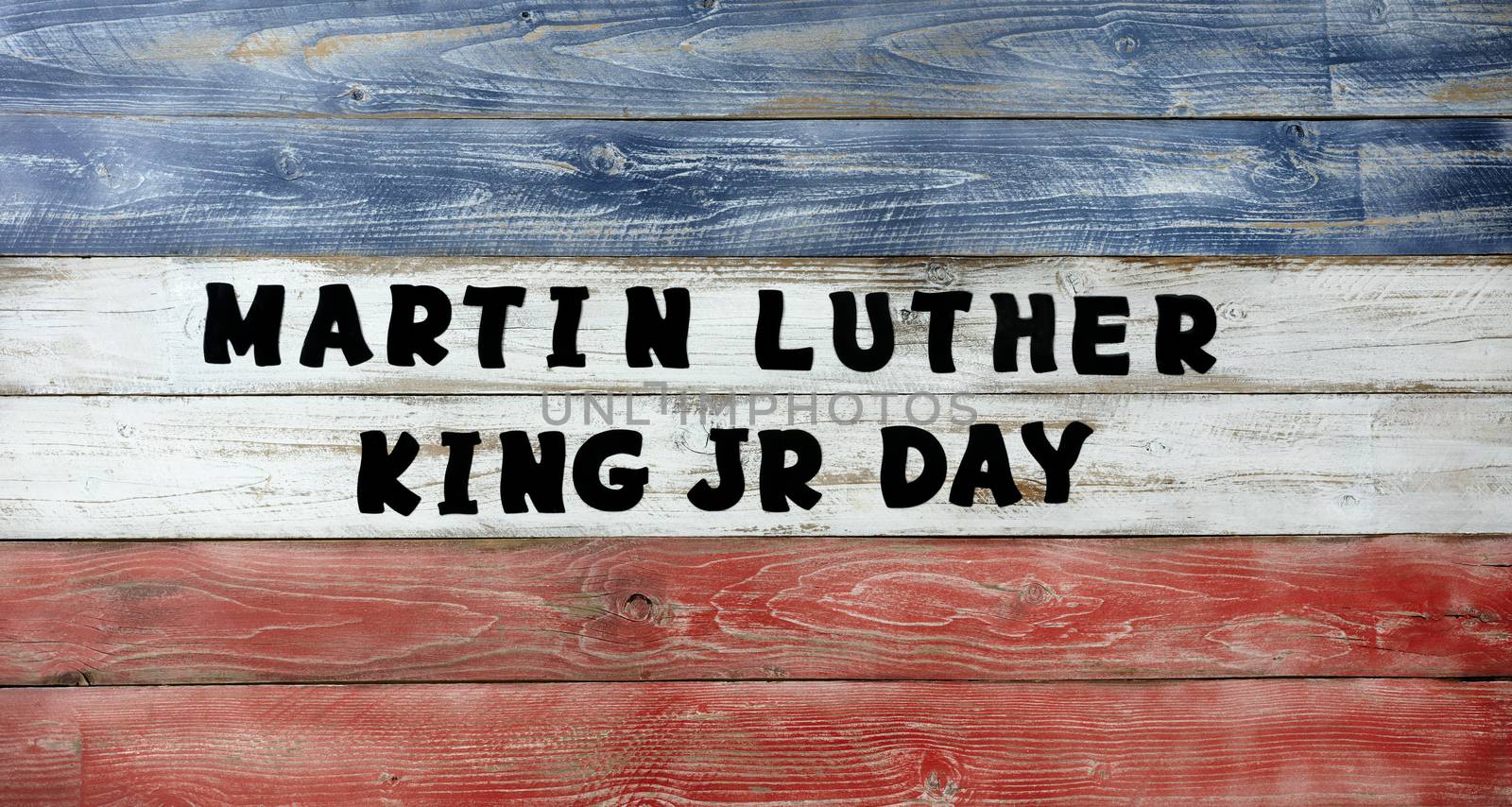 Martin Luther King JR Day large text letters on red, white and b by tab1962