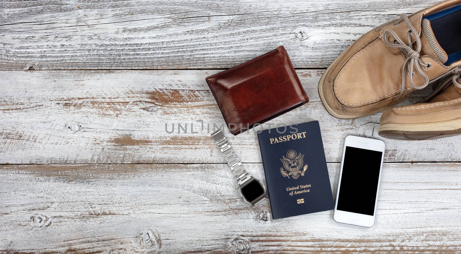 Travel passport and various related objects on white fade wooden by tab1962