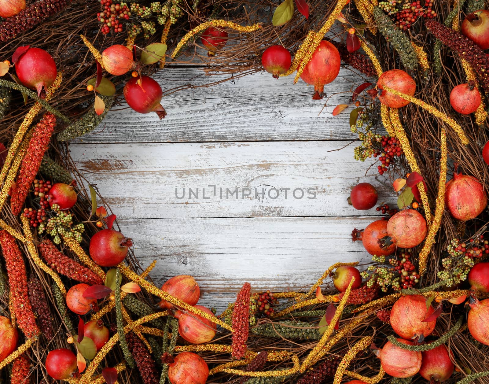Thanksgiving autumn decorations in circle border on white rustic wood 