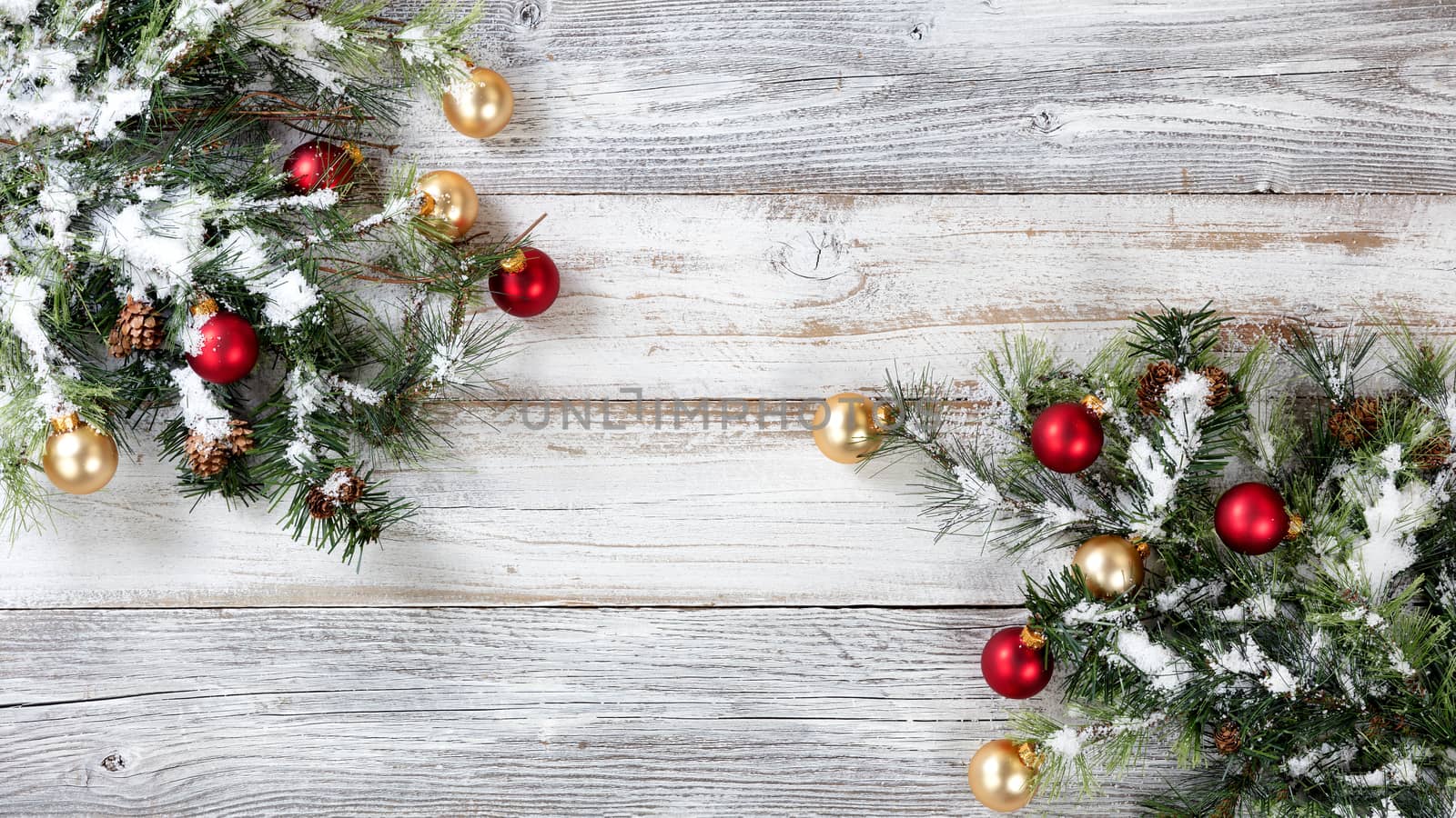 Christmas Rough Fir Tree decorated with red and gold ornaments on Weathered White Wooden Background