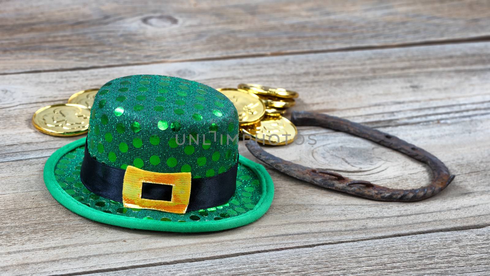 Close up of Lucky hat for St Patrick on rustic wooden background by tab1962