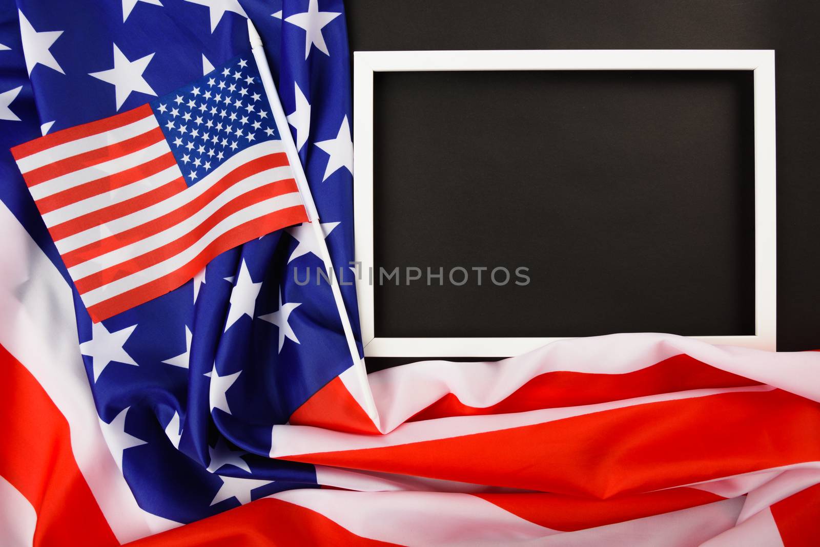 Martin luther king day, flat lay top view, American flag and photo frame on black background with copy space for your text