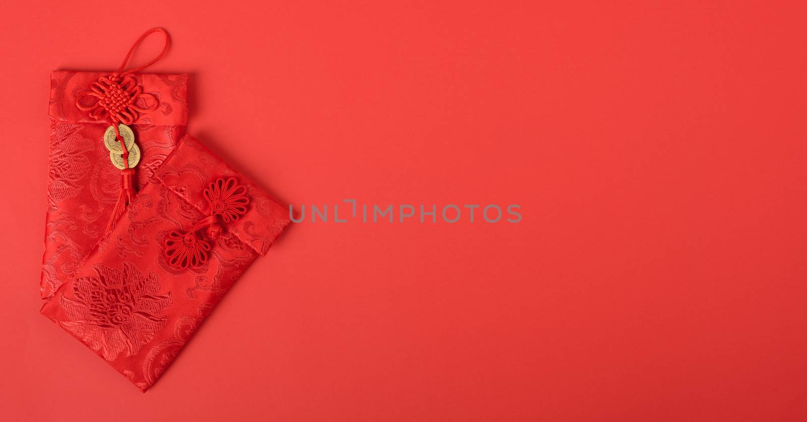 Chinese new year festival concept, flat lay top view, Happy Chinese new year with Red envelope (Character "FU" means fortune, blessing, wealth) on red background with copy space for your text