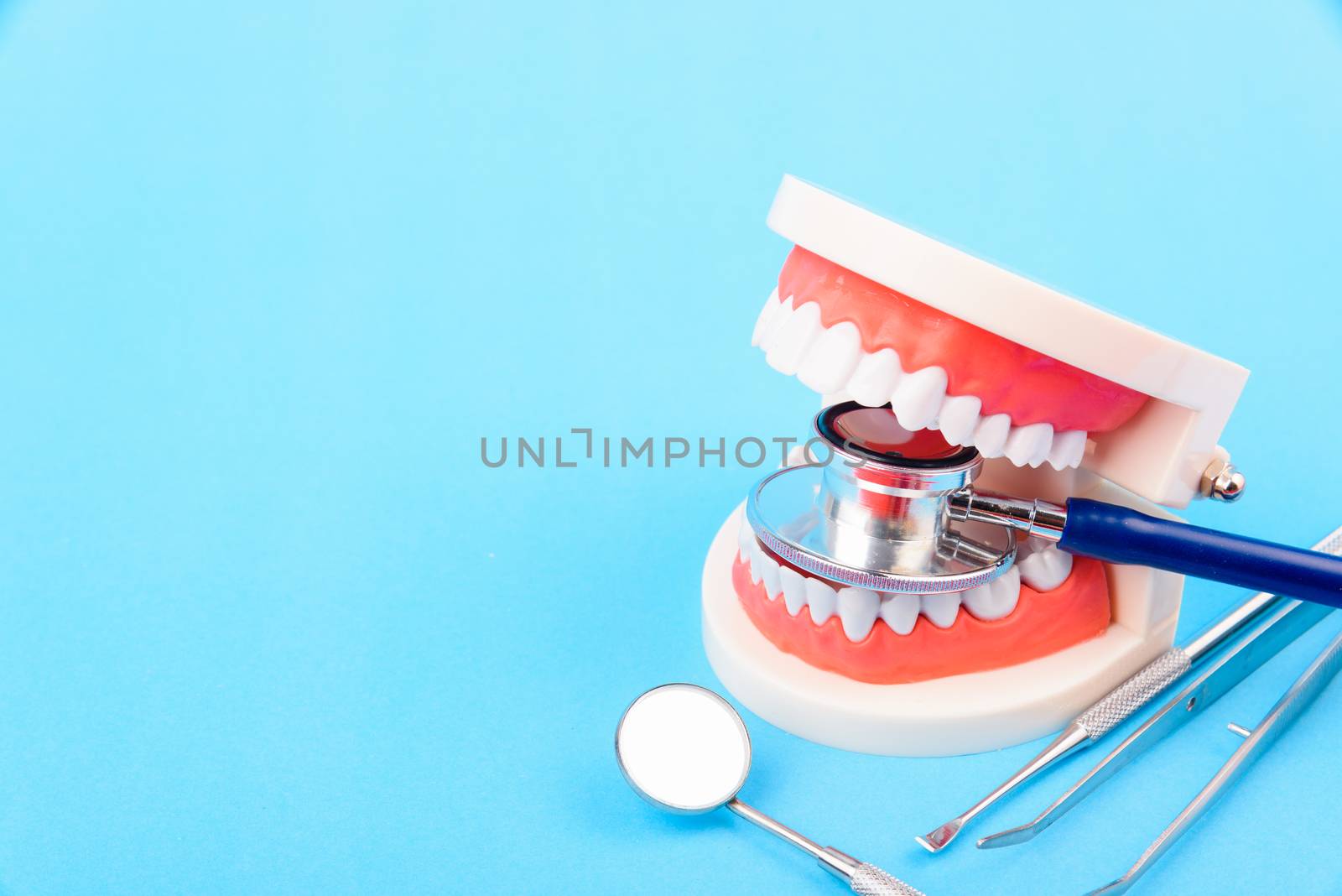 Dental Hygiene Health Concept, White tooth and Dentist tools for by Sorapop