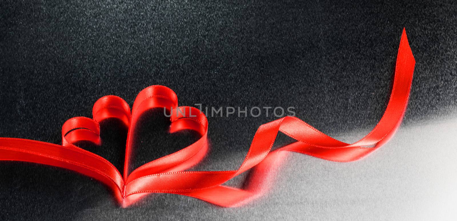 Red ribbon hearts on metal by Yellowj