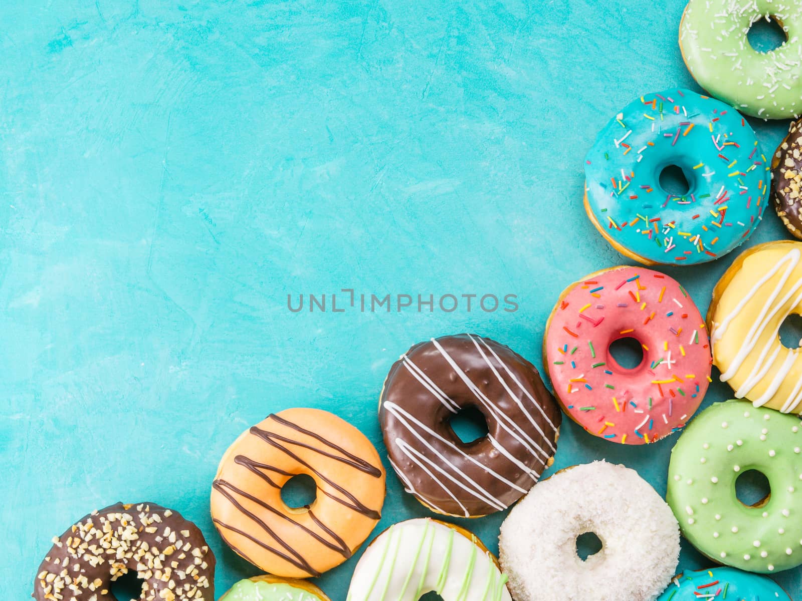 donuts on blue background , copy space, top view by fascinadora