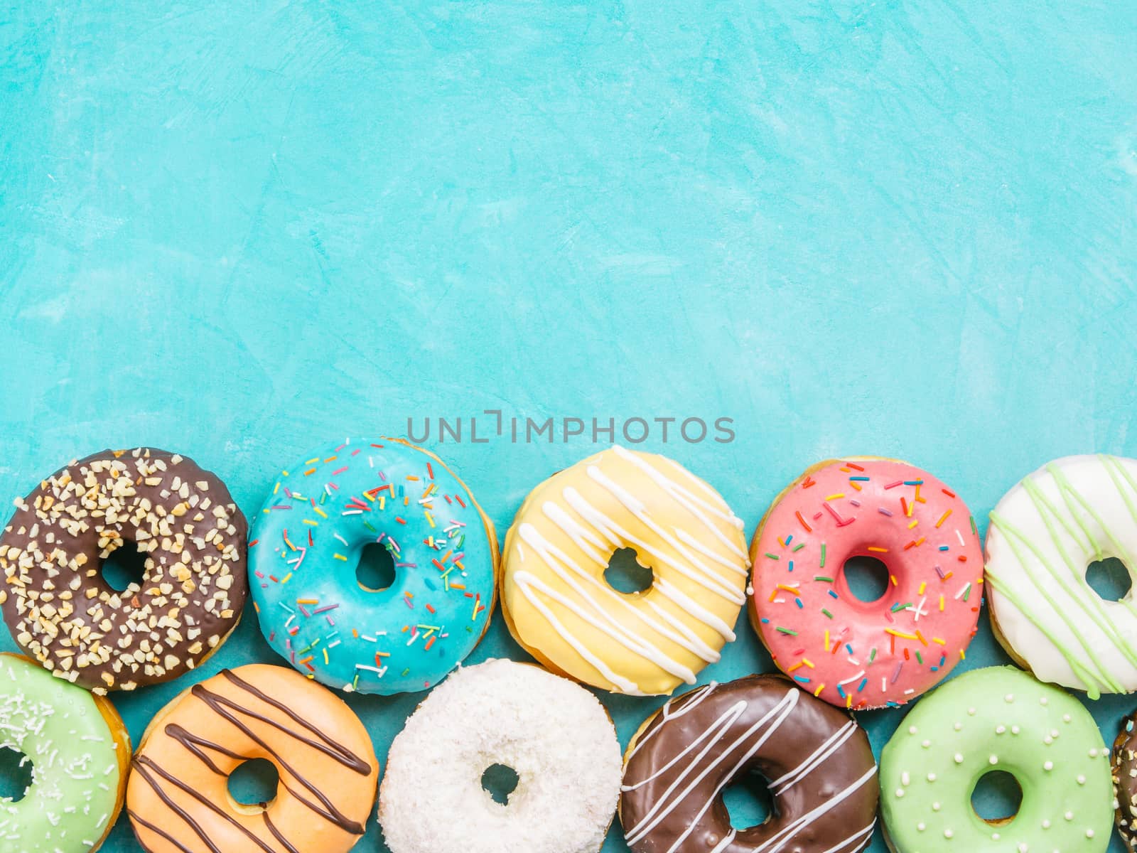 donuts on blue background , copy space, top view by fascinadora