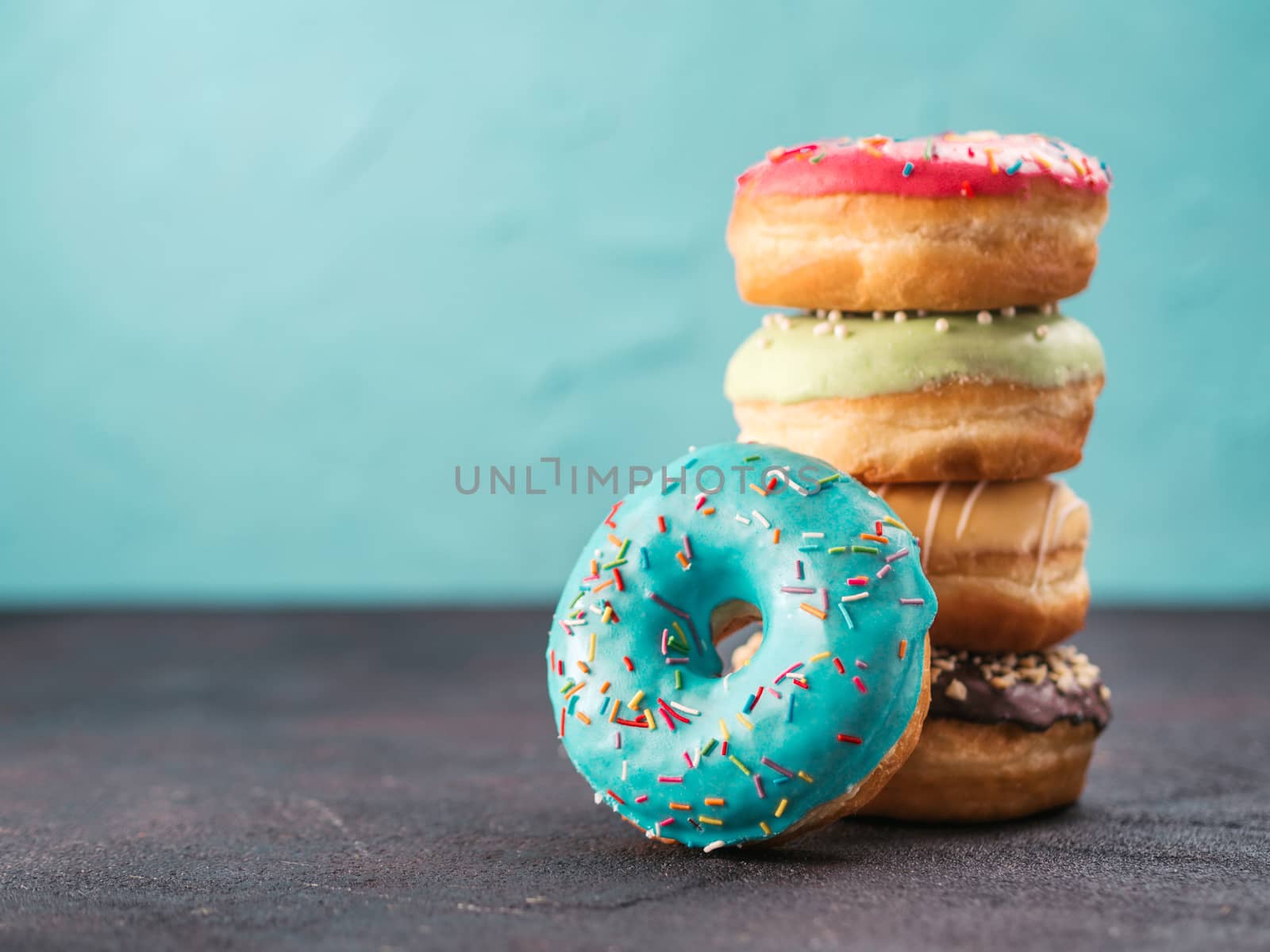 Stack of assorted donuts, copy space by fascinadora