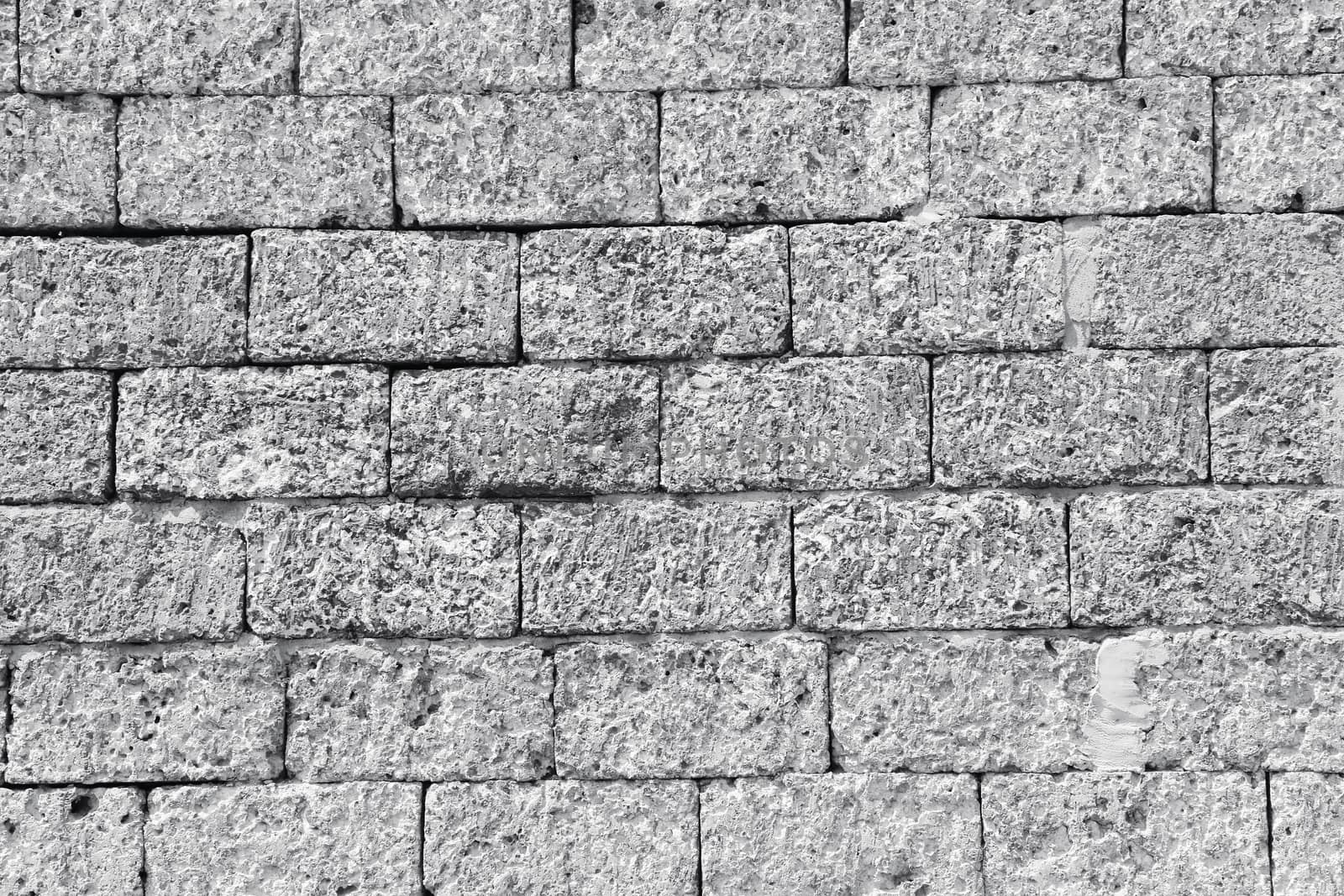 Black and white of semless background laterite wall textures.