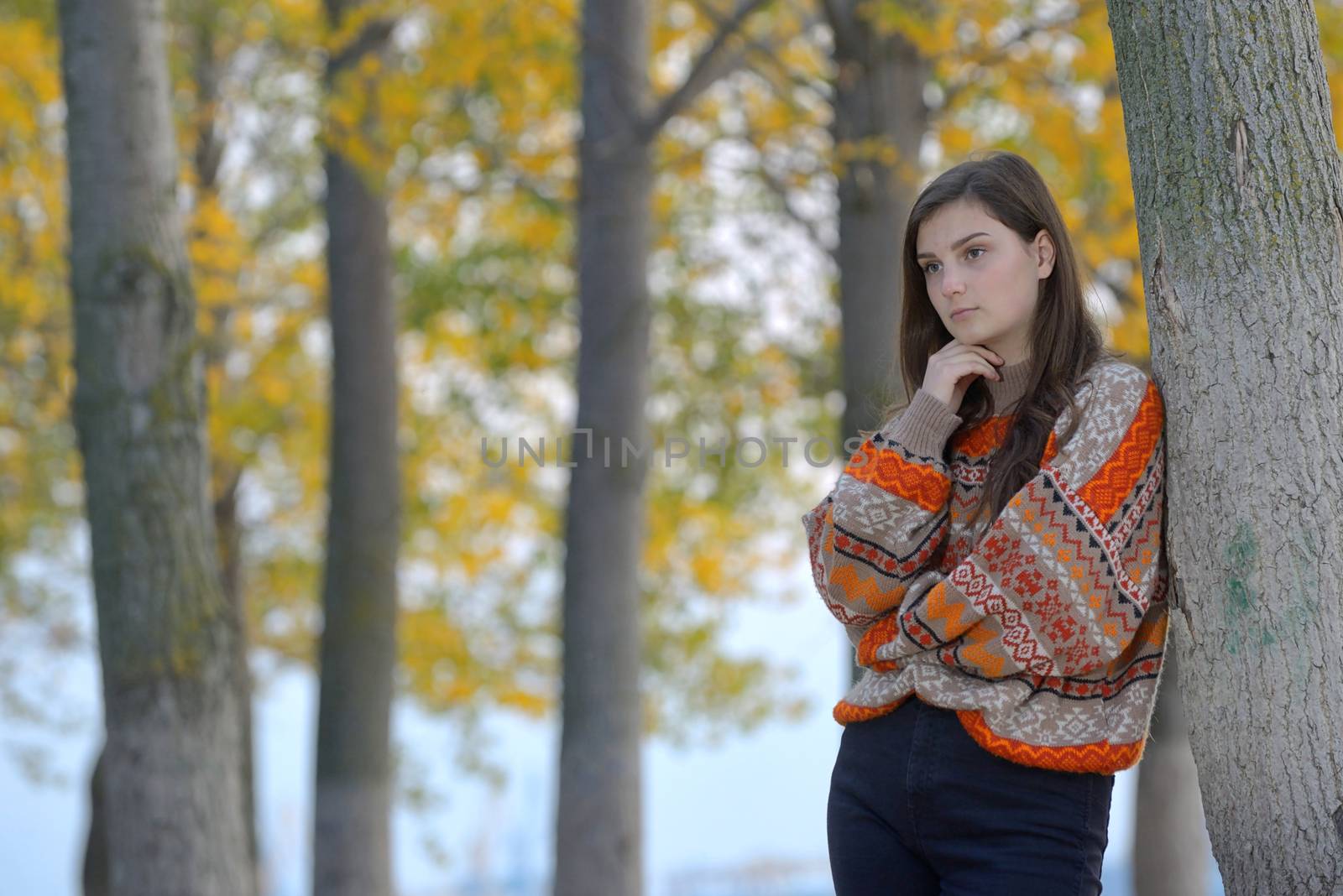 Portrait of a teen girl in autumn forest