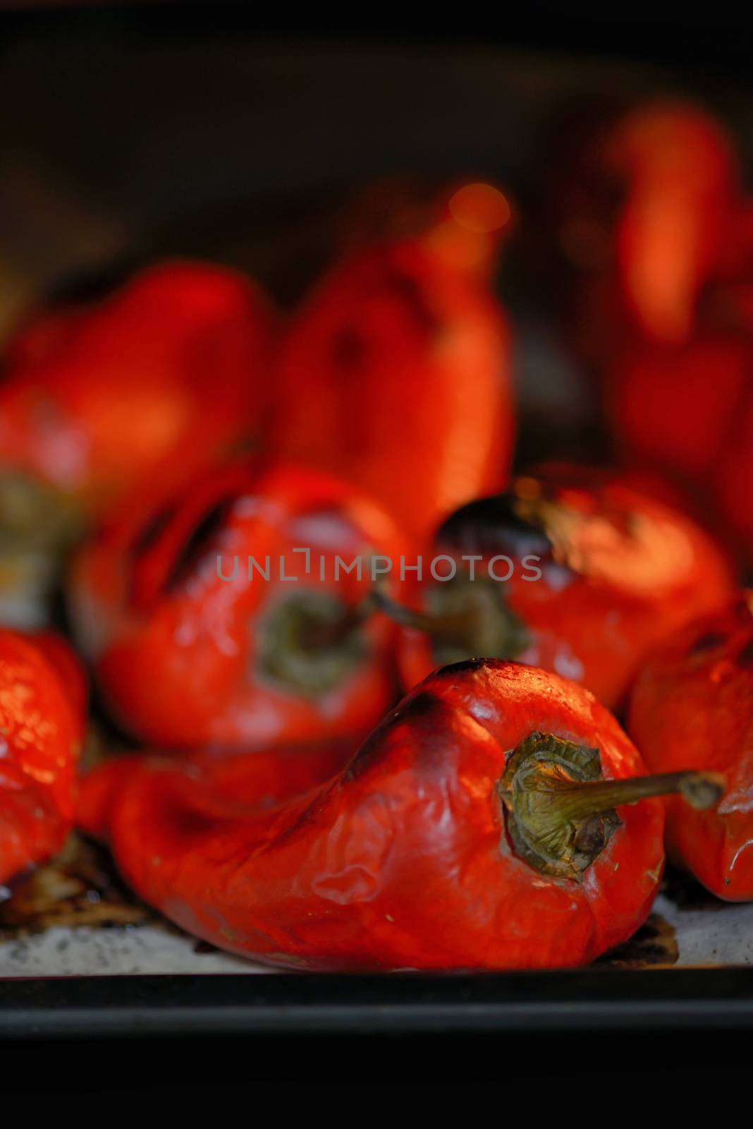 Red tasty peppers roasted in oven